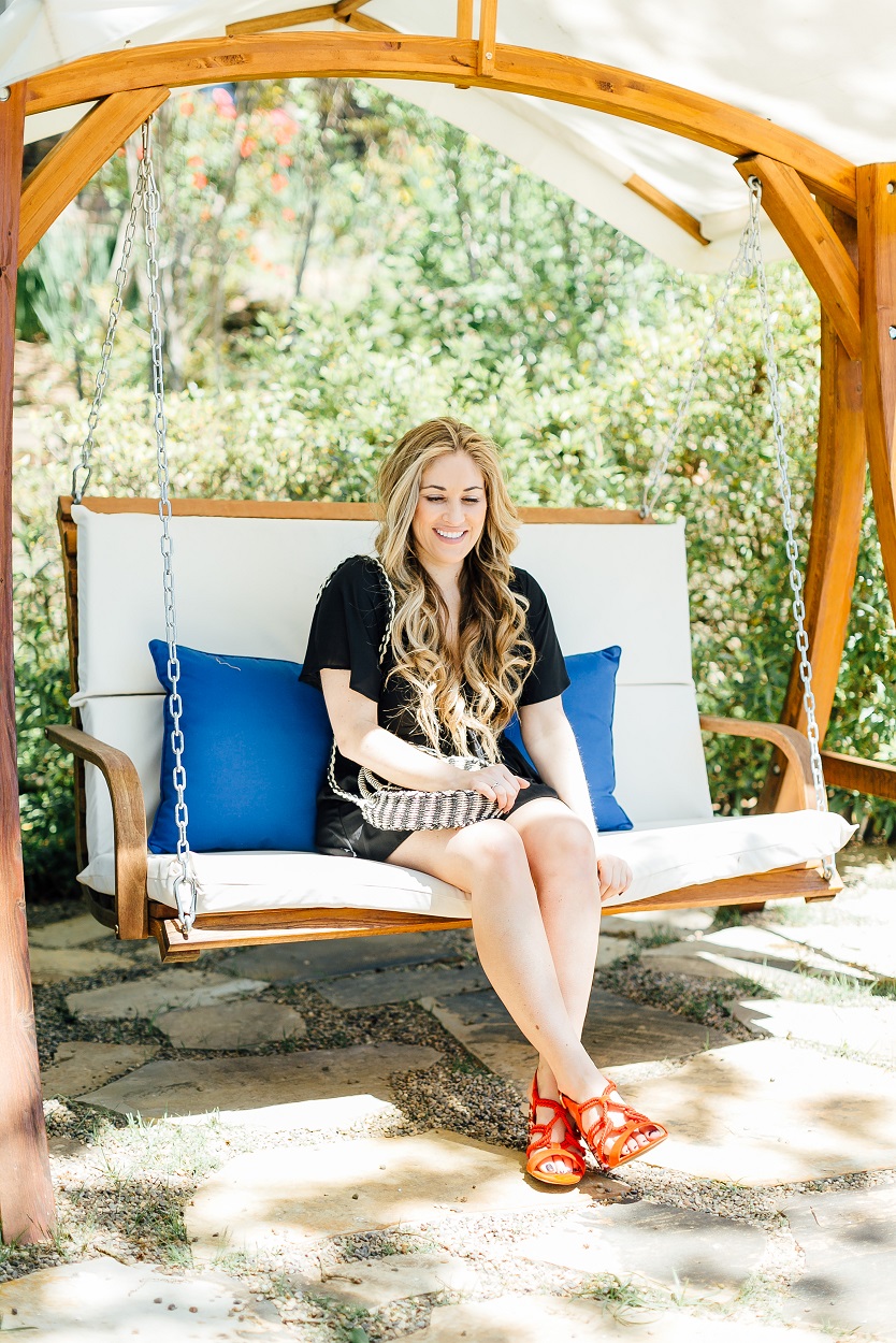 Tie black romper styled by popular fashion blogger, Walking in Memphis in High Heels