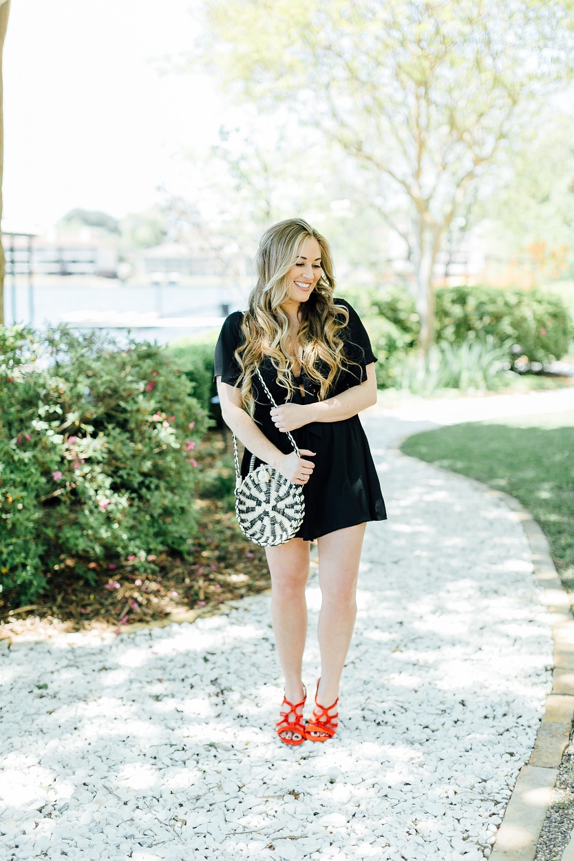 Tie black romper styled by popular fashion blogger, Walking in Memphis in High Heels