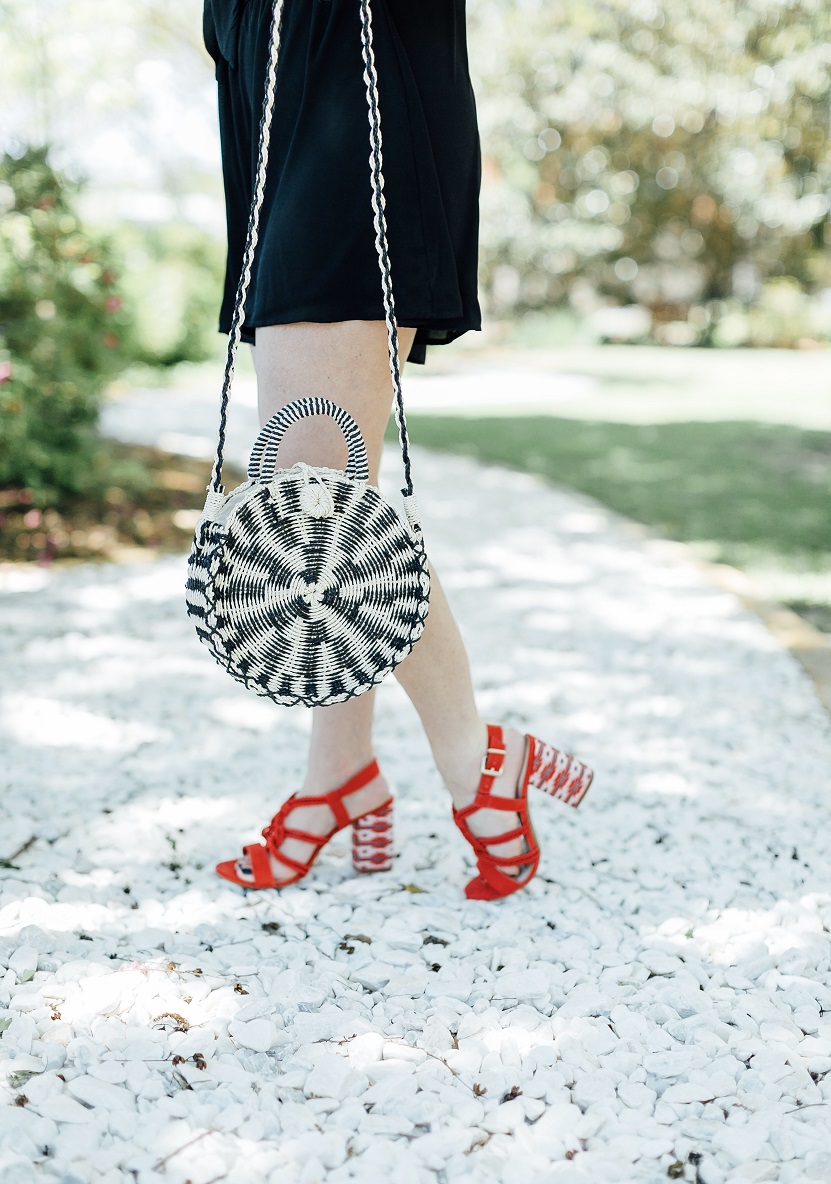 Tie black romper styled by popular fashion blogger, Walking in Memphis in High Heels
