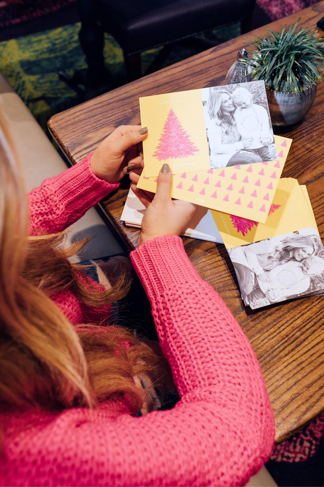 Minted Giveaway for your next Holiday Cards, featured by top lifestyle blog, Walking in Memphis in High Heels: blonde woman sitting smiling and holding her Minted Holiday cards