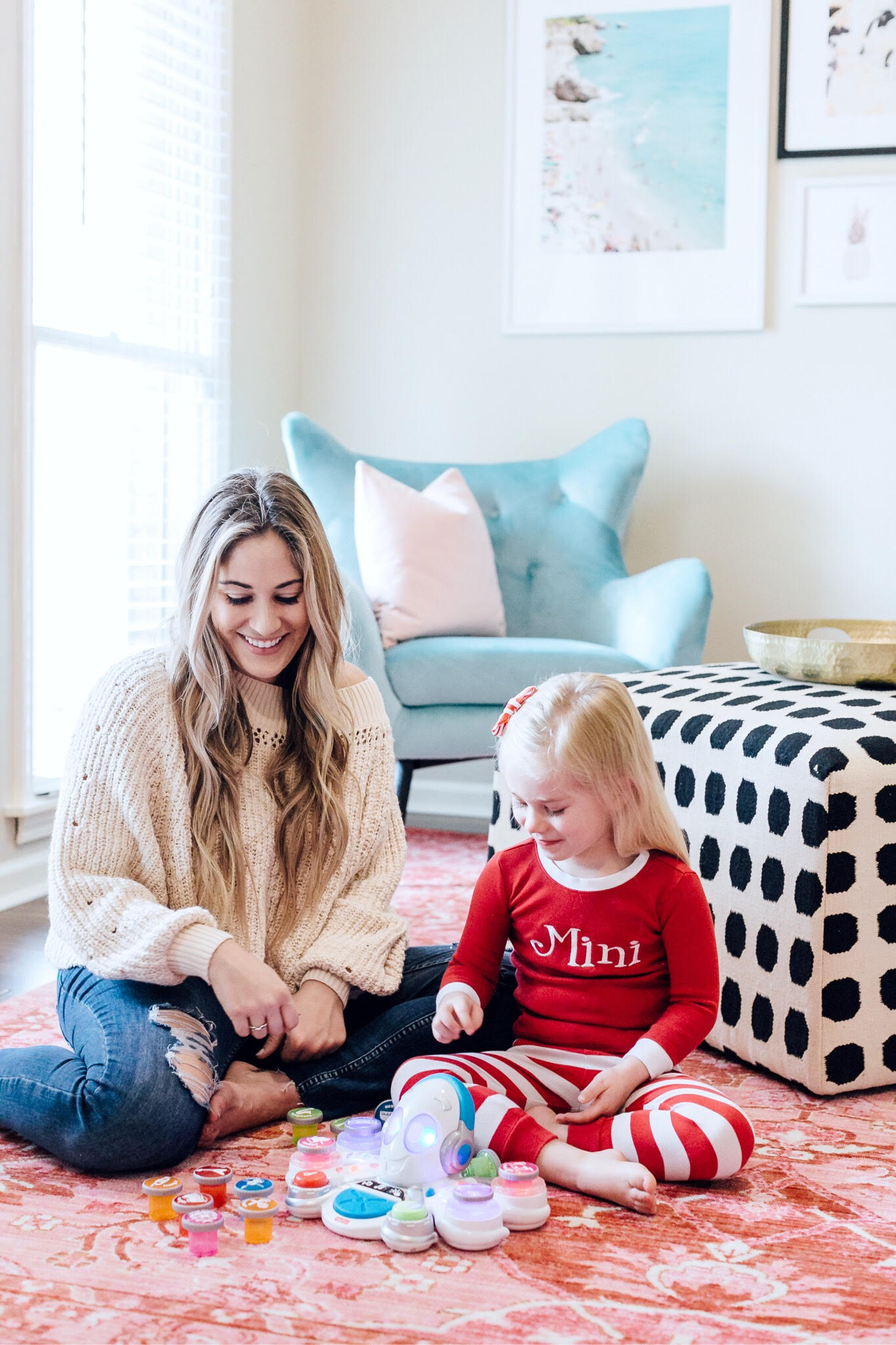 Top 10 Best Toys for Toddlers to Buy this Christmas featured by top US lifestyle blog, Walking in Memphis in High Heels: image of a mom and daughter duo playing with holiday toys