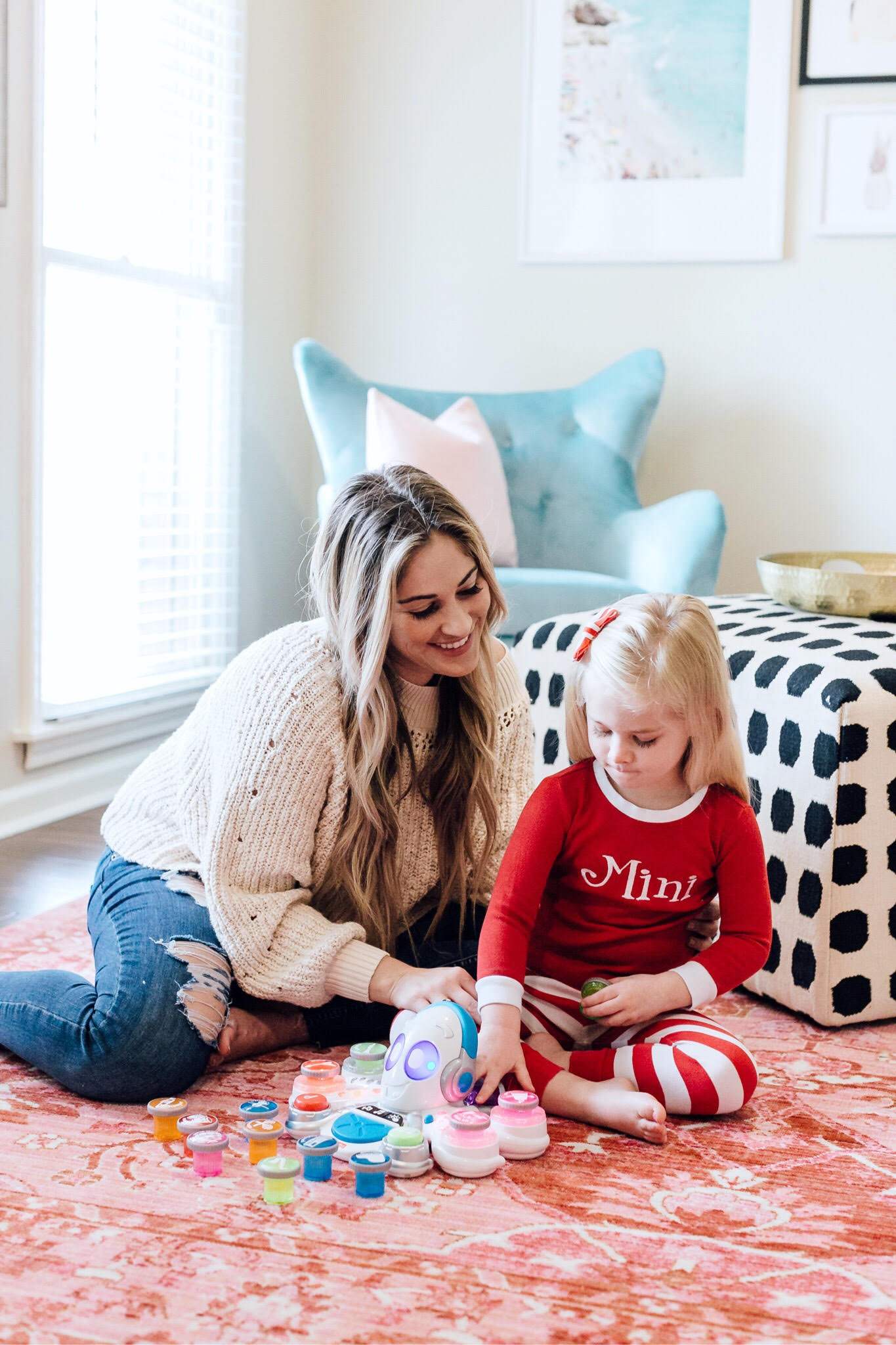 Top 10 Best Toys for Toddlers to Buy this Christmas featured by top US lifestyle blog, Walking in Memphis in High Heels: image of a mom and daughter duo playing with holiday toys