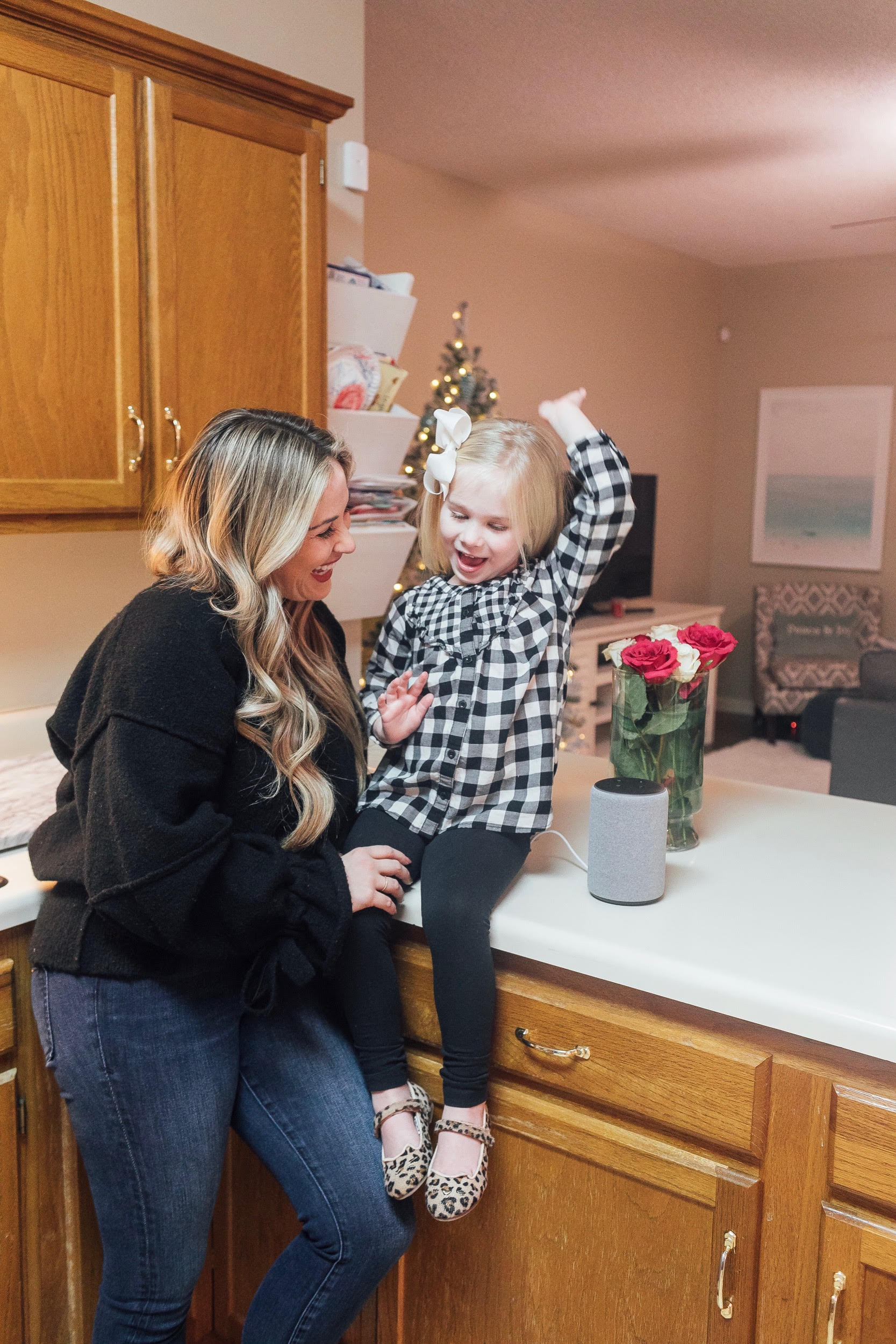 The New Amazon Echo Dot Kids review featured by top US lifestyle blog, Walking in Memphis in High Heels: image of a woman and daughter having fun using the new Amazon Echo Dot Kids.