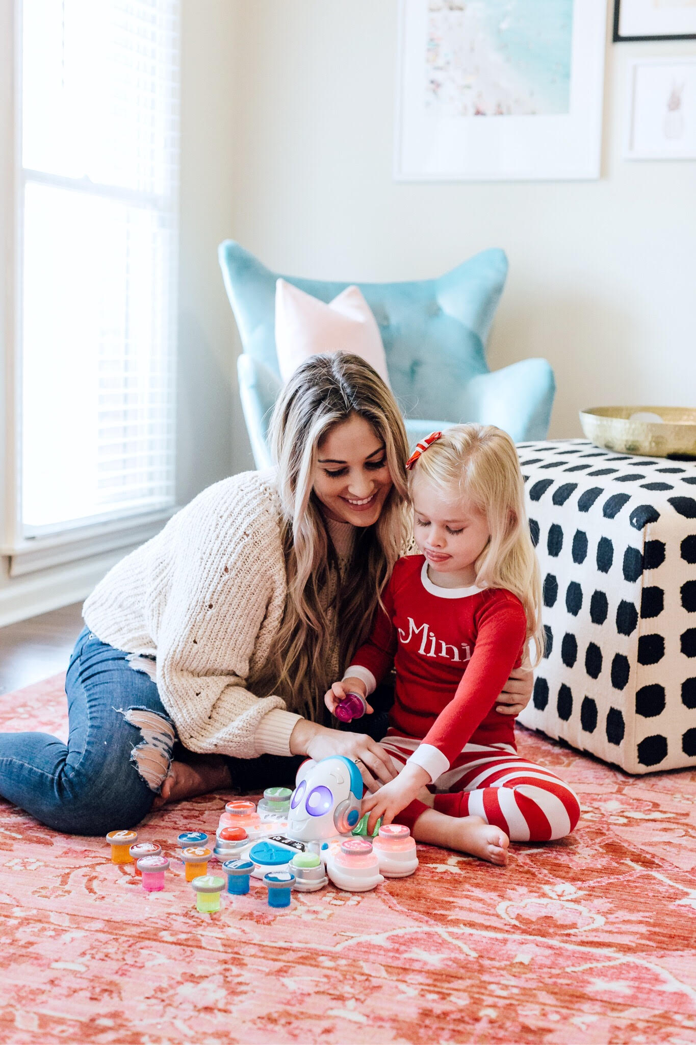 Top 10 Best Toys for Toddlers to Buy this Christmas featured by top US lifestyle blog, Walking in Memphis in High Heels: image of a mom and daughter duo playing with holiday toys