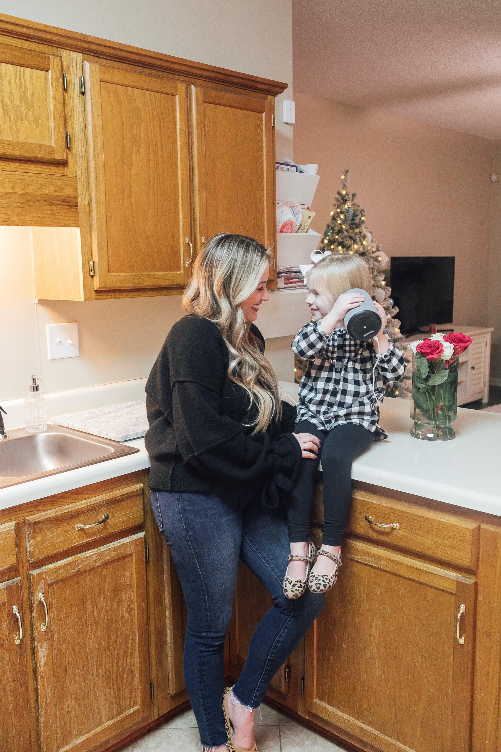The New Amazon Echo Dot Kids review featured by top US lifestyle blog, Walking in Memphis in High Heels: image of a woman and daughter having fun using the new Amazon Echo Dot Kids.