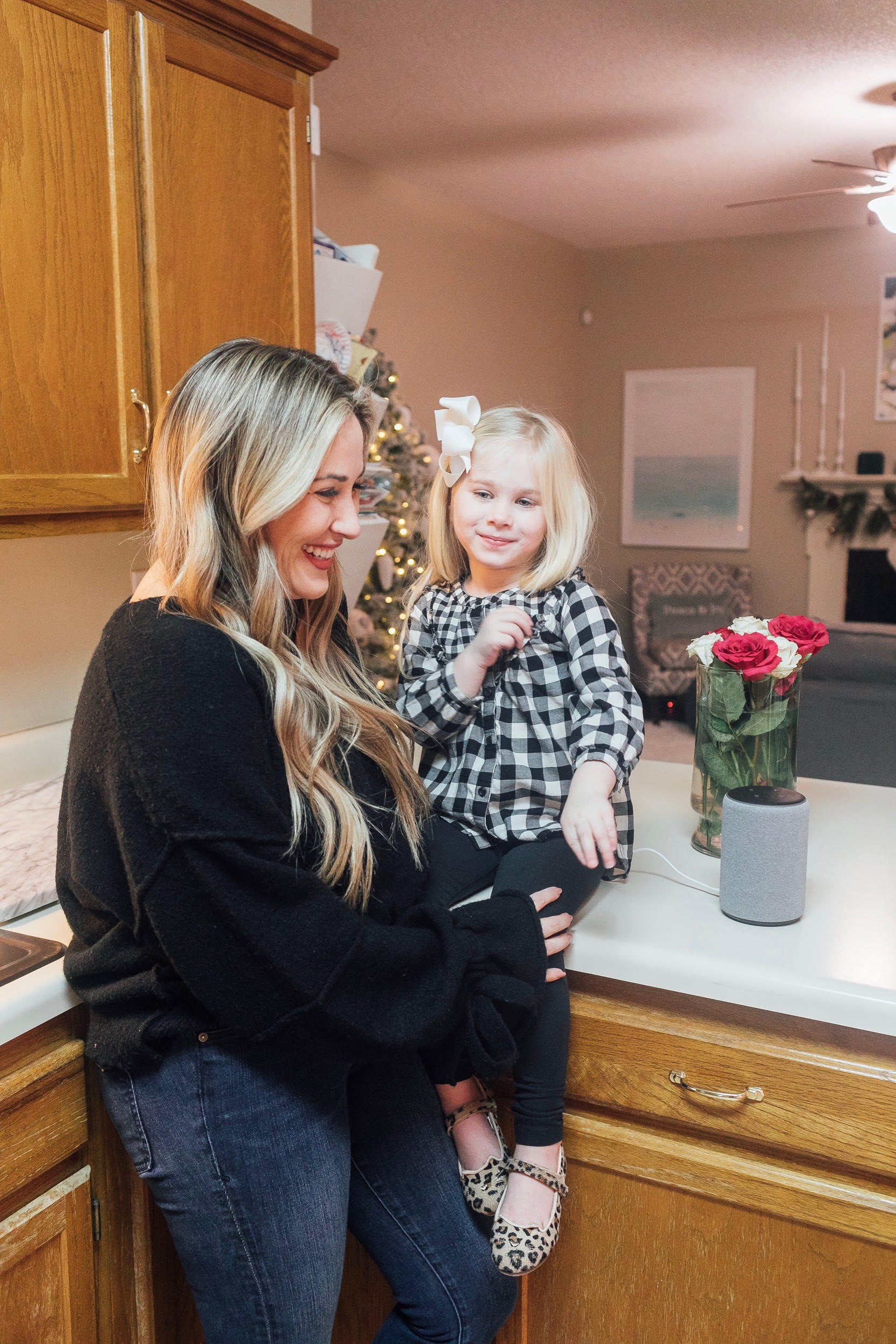 The New Amazon Echo Dot Kids review featured by top US lifestyle blog, Walking in Memphis in High Heels: image of a woman and daughter having fun using the new Amazon Echo Dot Kids.