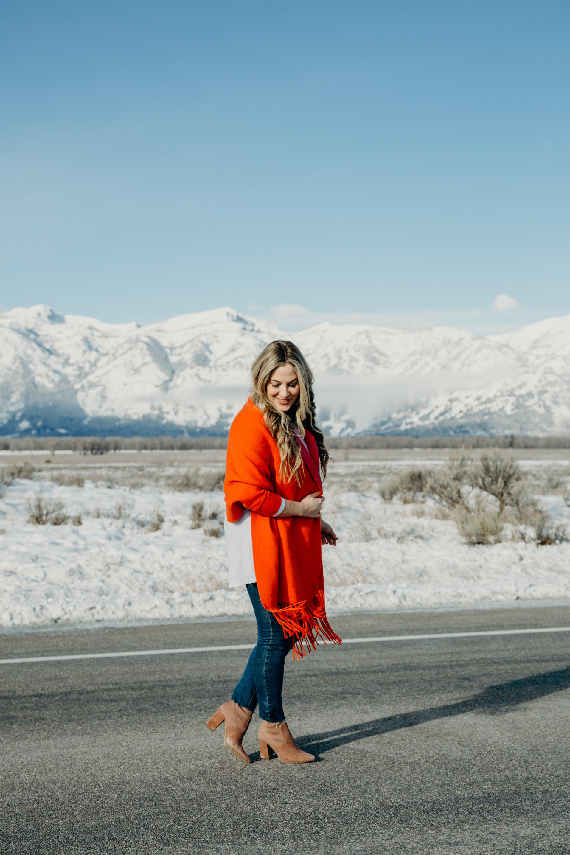 Bright Clothing for Winter featured by top US fashion blog, Walking in Memphis in High Heels: image of a woman wearing a reversible travel wrap