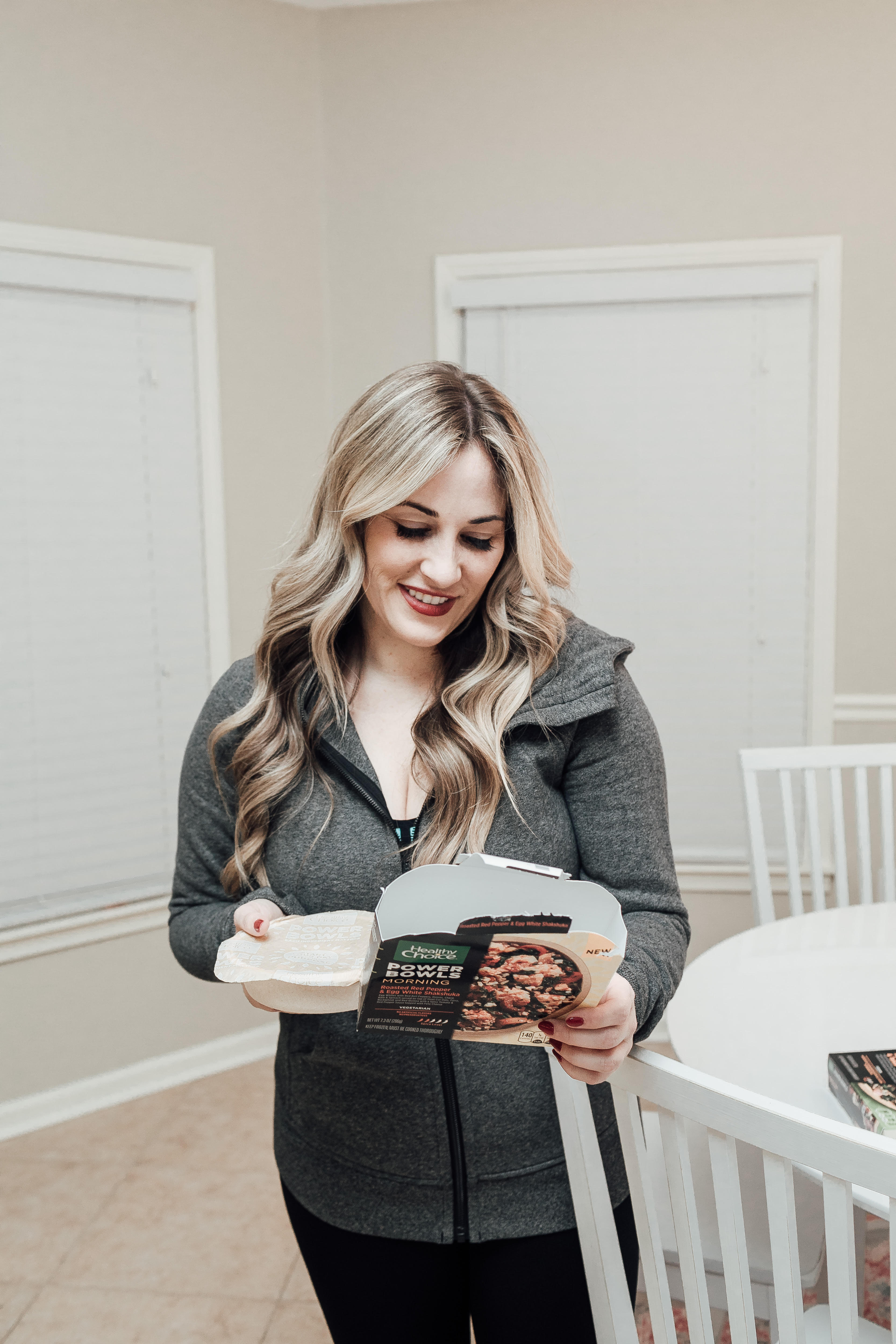 Healthy Choice Power Bowls: Quick, Easy & Filling Meals for on the Go featured by top US lifestyle blog, Walking in Memphis in High Heels: image of a woman holding Healthy Choice Power Bowls