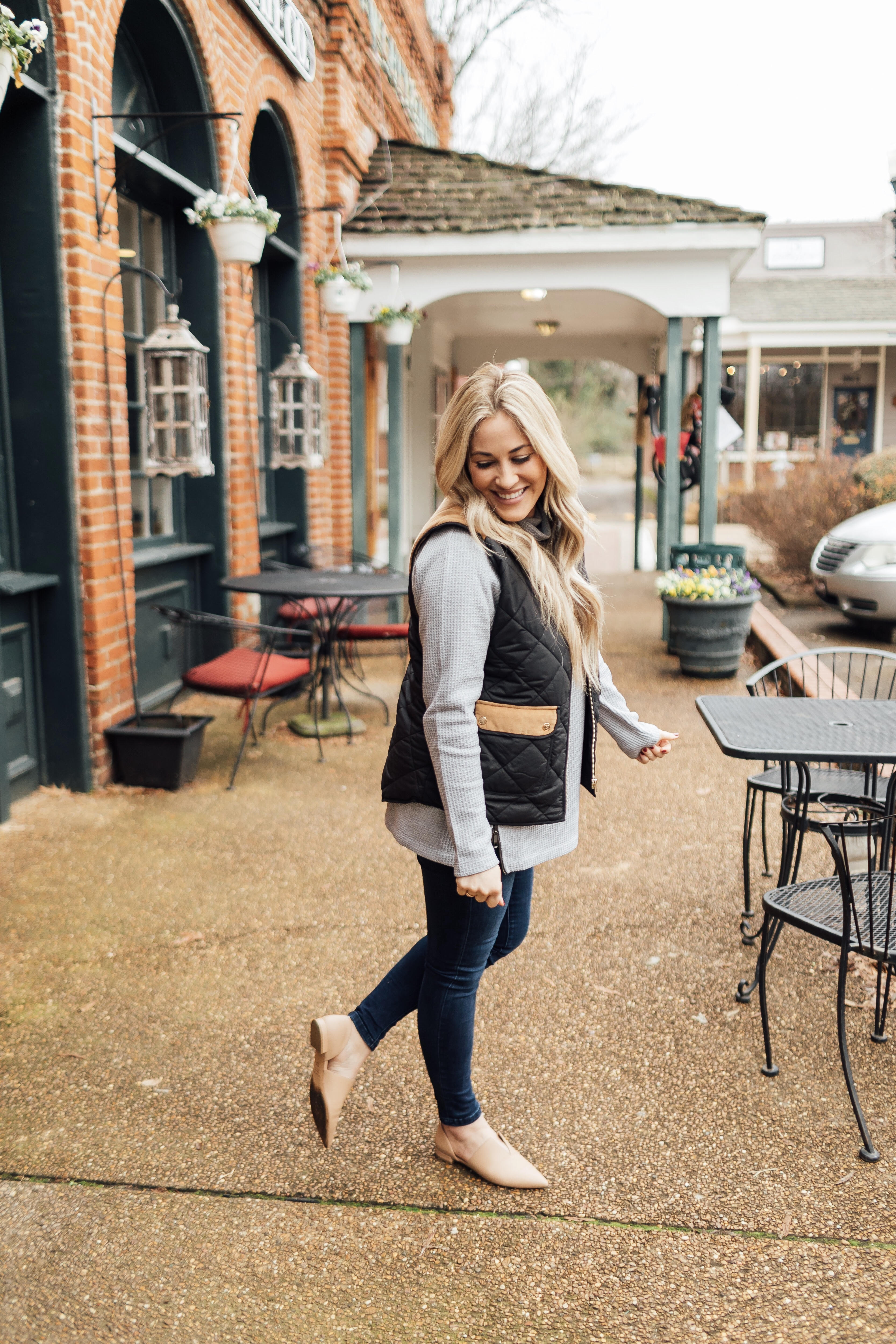 Must have LL Bean thermal top featured by top US fashion blog, Walking in Memphis in High Heels: image of a woman wearing an LL Bean MockNeck Thermal top, Lauren James vest, Joe’s Jeans skinny ankle jeans and Vince Camuto flats.