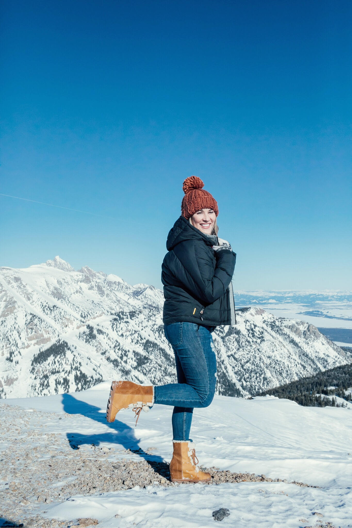 SOREL Sherpa boots styled by top US fashion blog, Walking in Memphis in High Heels: image of a woman wearing SOREL sherpa boots, a Pink Lily sweater, LOLE puffer jacket and Free People skinny jeans