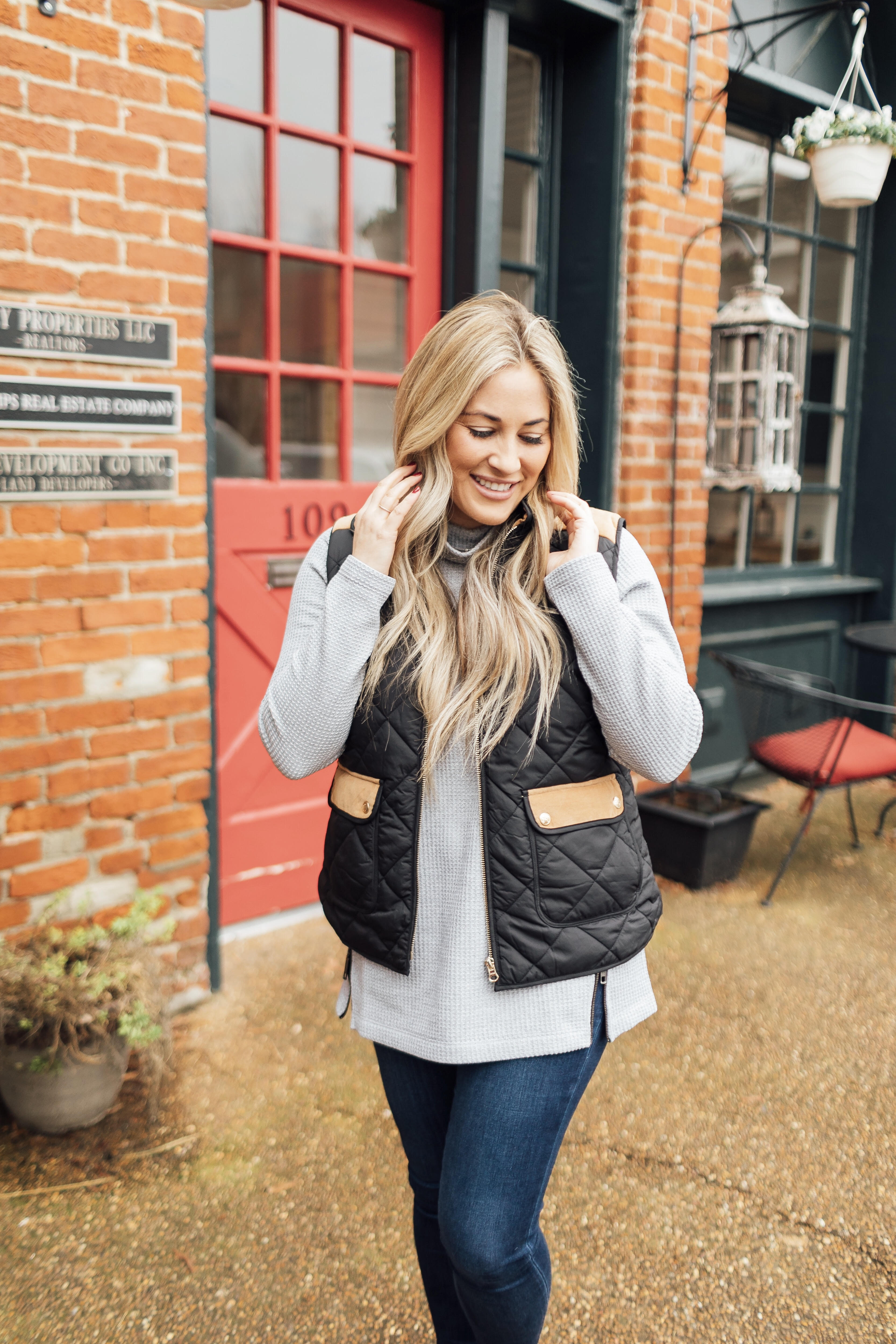 Must have LL Bean thermal top featured by top US fashion blog, Walking in Memphis in High Heels: image of a woman wearing an LL Bean MockNeck Thermal top, Lauren James vest, Joe’s Jeans skinny ankle jeans and Vince Camuto flats.