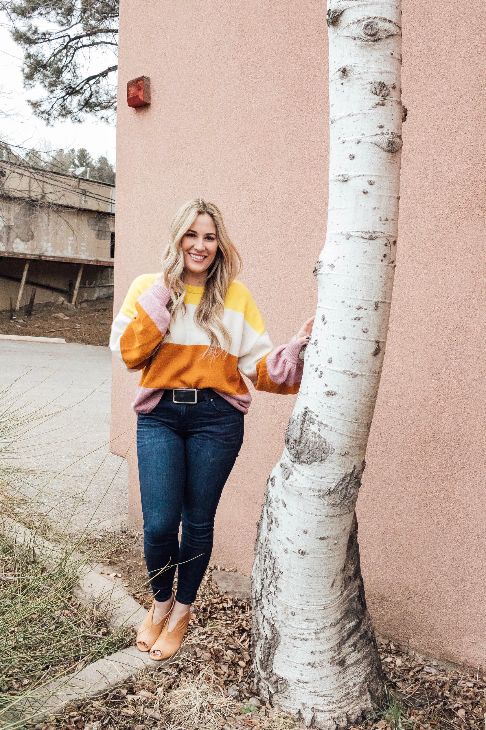 Madewell Sweater to take you from Winter to Spring styled by top US fashion blog, Walking in Memphis in High Heels: image of a woman wearing a colorblock Madewell sweater, KUT ankle skinny jeans and Vince Camuto shooties