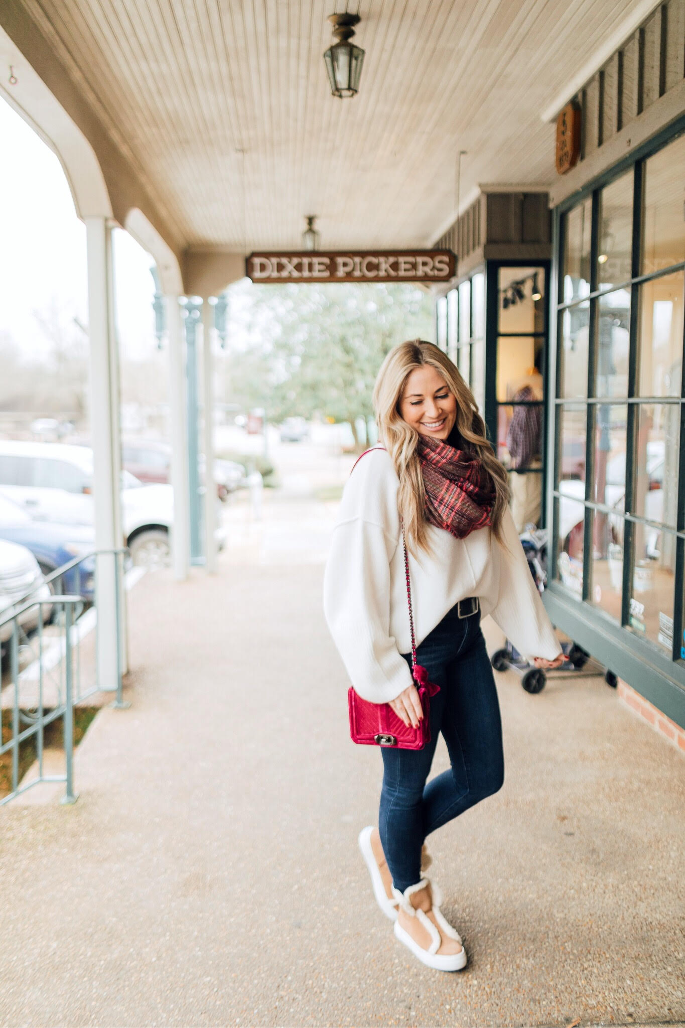 Jack Rogers sherpa sneakers featured by top fashion blog, Walking in Memphis in High Heels: image of a woman wearing sherpa sneakers, Dillards oversized sweater, Nordstrom Rack skinny ankle jeans, Sole Society plaid scarf, and an Evereve pom beanie