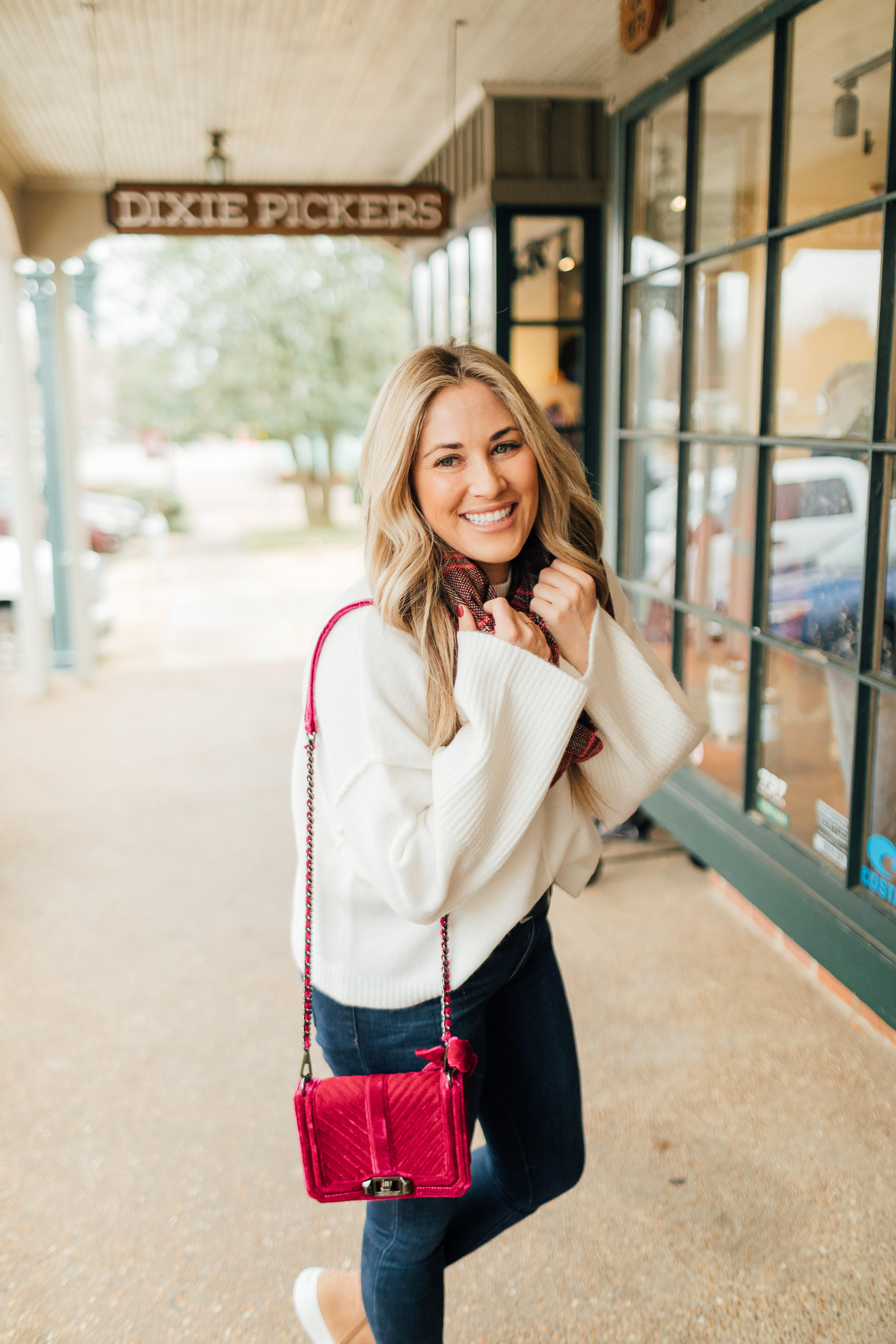 Jack Rogers sherpa sneakers featured by top fashion blog, Walking in Memphis in High Heels: image of a woman wearing sherpa sneakers, Dillards oversized sweater, Nordstrom Rack skinny ankle jeans, Sole Society plaid scarf, and an Evereve pom beanie