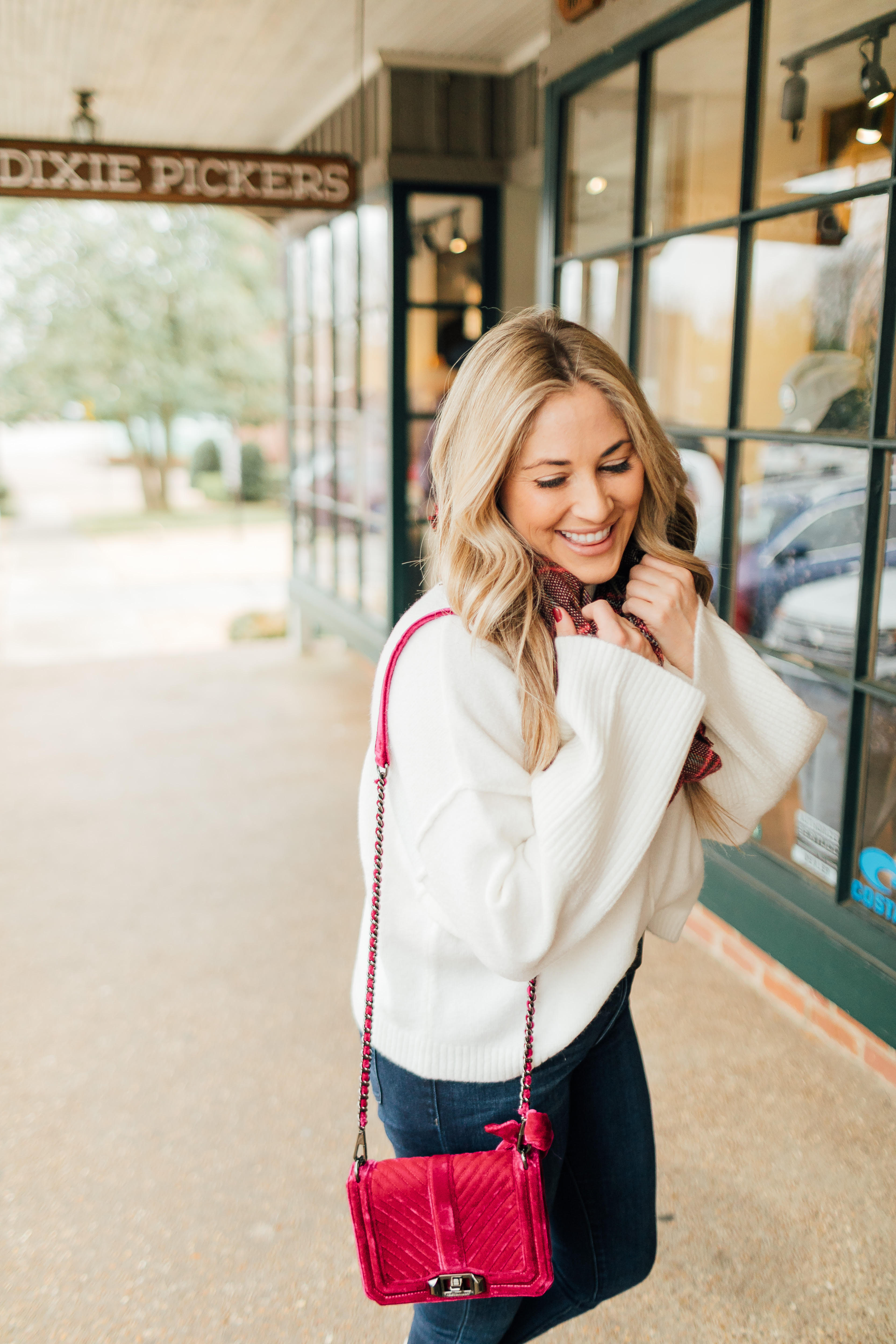 Jack Rogers sherpa sneakers featured by top fashion blog, Walking in Memphis in High Heels: image of a woman wearing sherpa sneakers, Dillards oversized sweater, Nordstrom Rack skinny ankle jeans, Sole Society plaid scarf, and an Evereve pom beanie