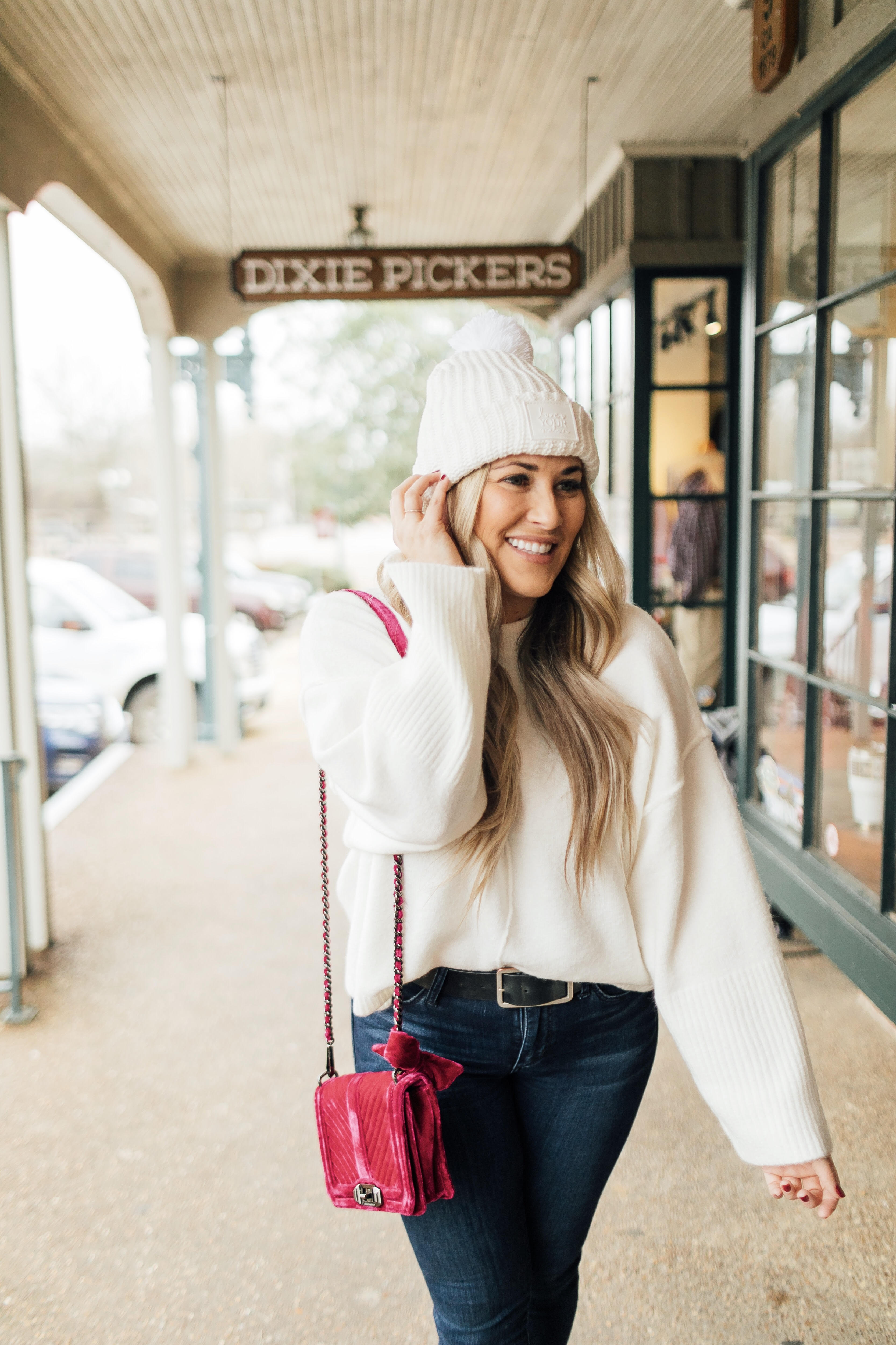 Jack Rogers sherpa sneakers featured by top fashion blog, Walking in Memphis in High Heels: image of a woman wearing sherpa sneakers, Dillards oversized sweater, Nordstrom Rack skinny ankle jeans, Sole Society plaid scarf, and an Evereve pom beanie