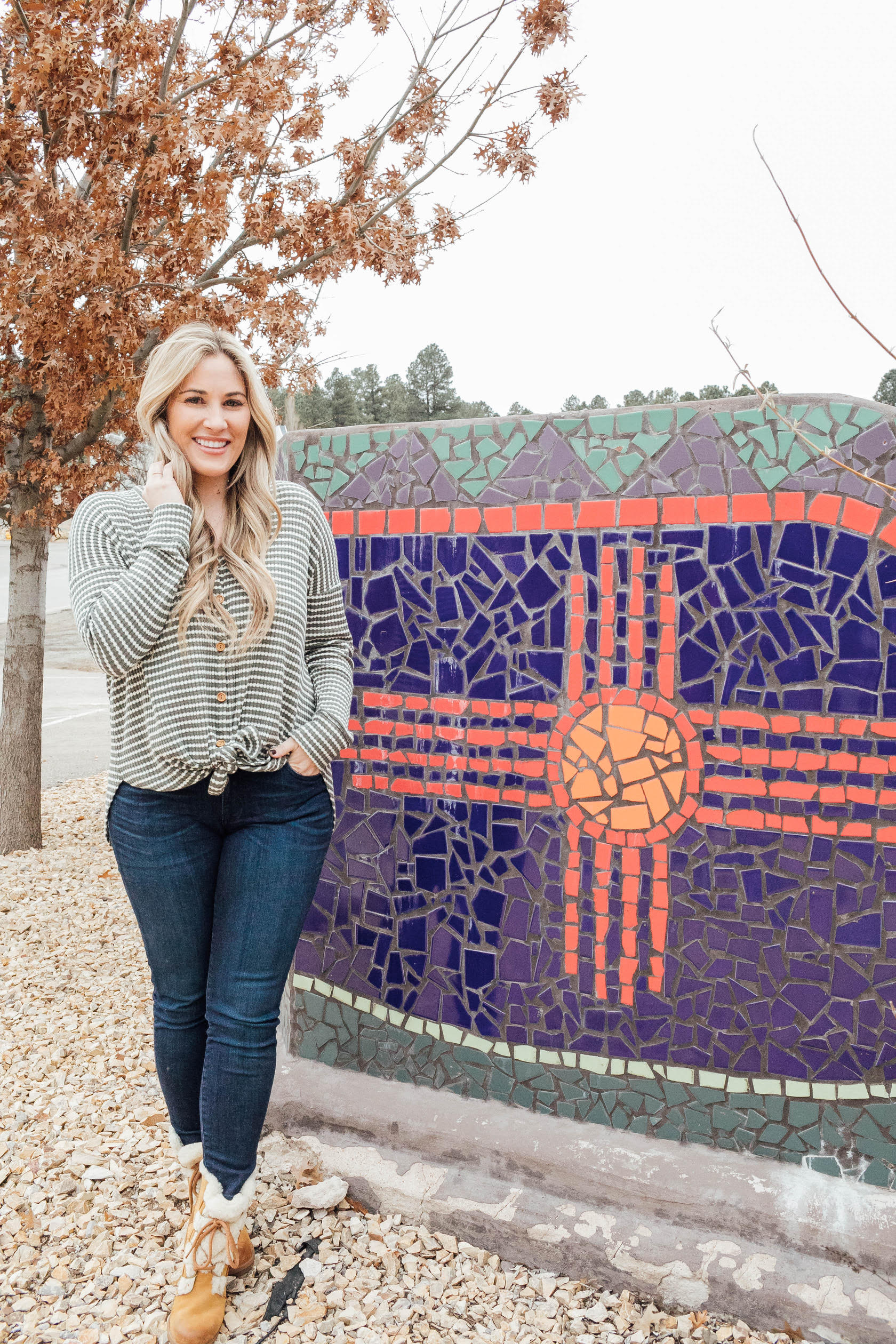 Cute winter sherpa boots styled by top US fashion blog, Walking in Memphis in High Heels: image of a woman wearing a Grace and Lace thermal top, Zappos skinny jeans, Patagonia vest, Sorel sherpa boots and Grace and Lace knit pom beanie