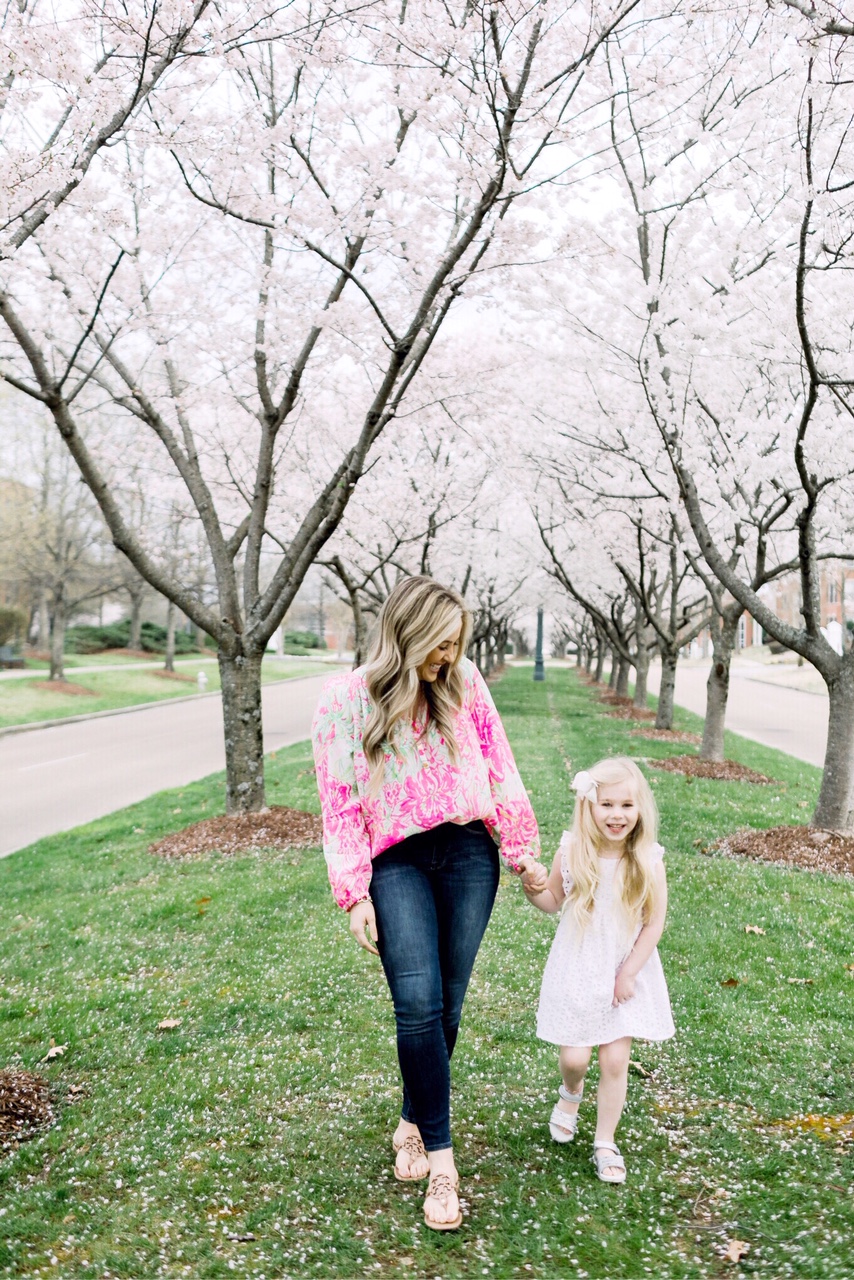 Easter fashion and outfit ideas featured by top US fashion blog, Walking in Memphis in High Heels: image of a woman wearing a Lilly Pulitzer silk top, Good American skinny jeans and Tory Burch sandals and a girl wearing a Lilly Pulitzer eyelet dress and Pediped silver sandals