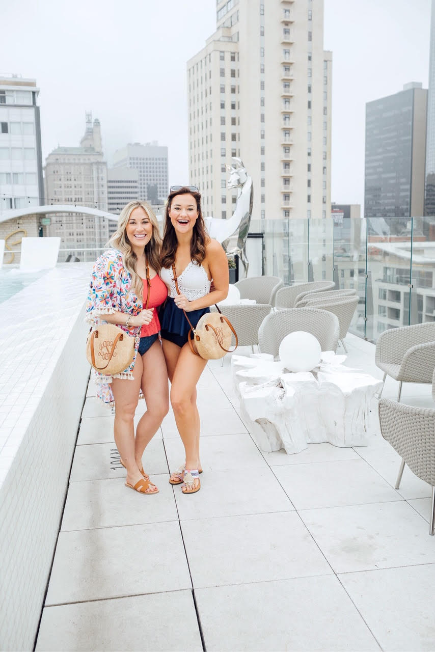 The best swimsuits for moms featured by top US fashion blog, Walking in Memphis in High Heels: image of a woman wearing a MarleyLilly floral coverup and circle crossbody, Steve Madden sandals and a Rad Swim tankini.