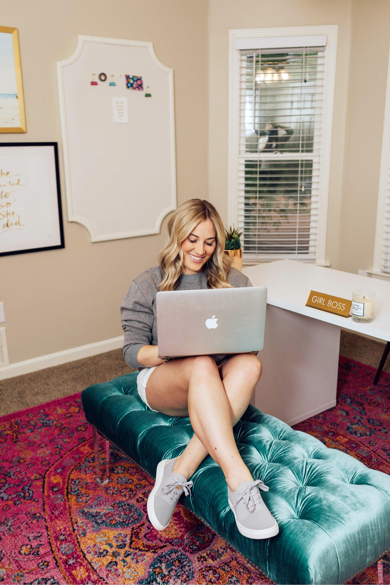 Versatile & Comfortable Sneaker featured by top US fashion blog, Walking in Memphis in High Heels: image of a woman wearing a Marleylilly sweatshirt, Madewell white denim shorts and Comfortiva sneakers.