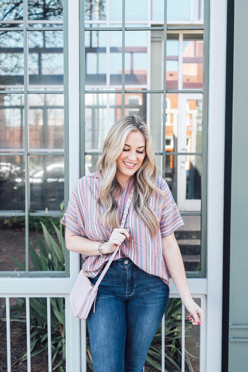 Comfortiva Gella tassel sandals style by top US fashion blog, Walking in Memphis in High Heels: image of a woman wearing a Madewell striped shirt, Good American skinny jeans, a Madewell crossbody bag, and Comfortiva Gella tassel sandals