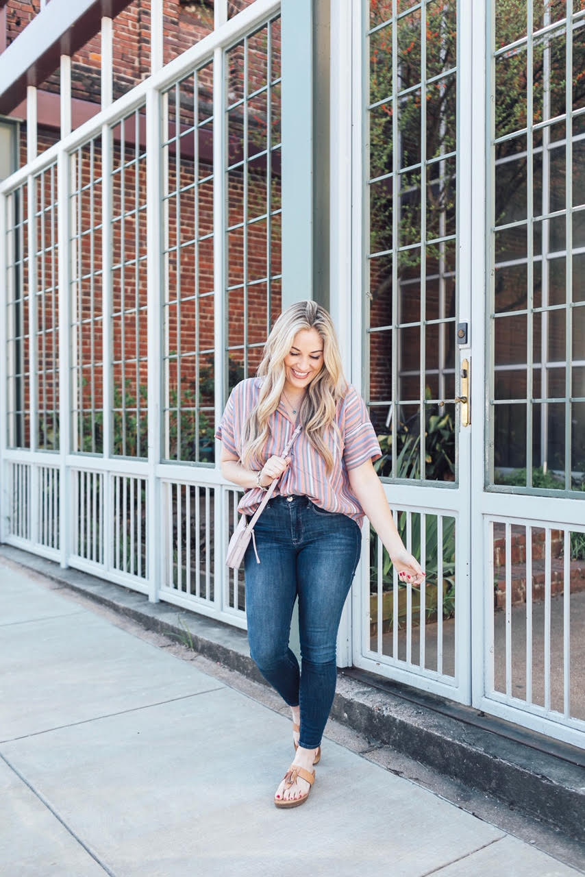 Comfortiva Gella tassel sandals style by top US fashion blog, Walking in Memphis in High Heels: image of a woman wearing a Madewell striped shirt, Good American skinny jeans, a Madewell crossbody bag, and Comfortiva Gella tassel sandals