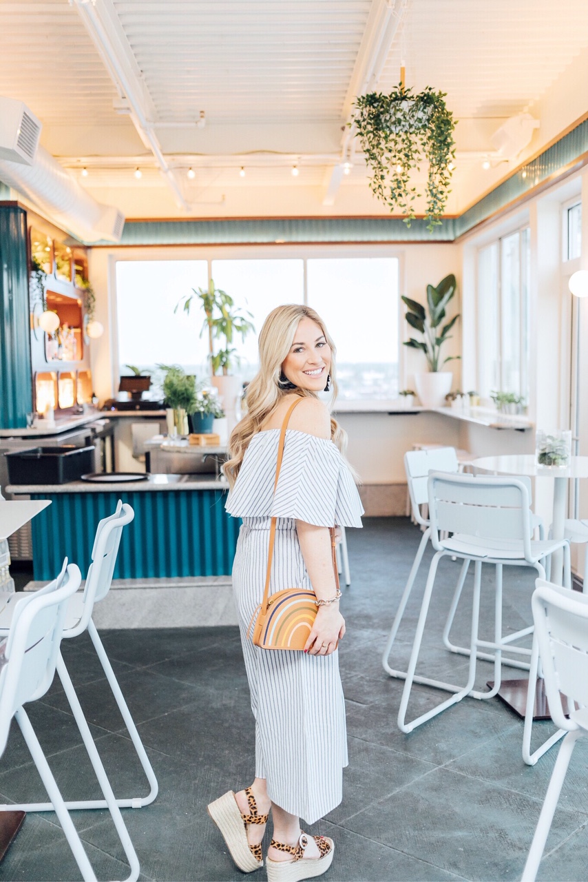 Memorial Day outfits featured by top US fashion blog, Walking in Memphis in High Heels: image of a woman wearing a Morning Lavender striped off the shoulder jumpsuit, Marc Fisher platform espadrille sandals, Madewell rainbow bag