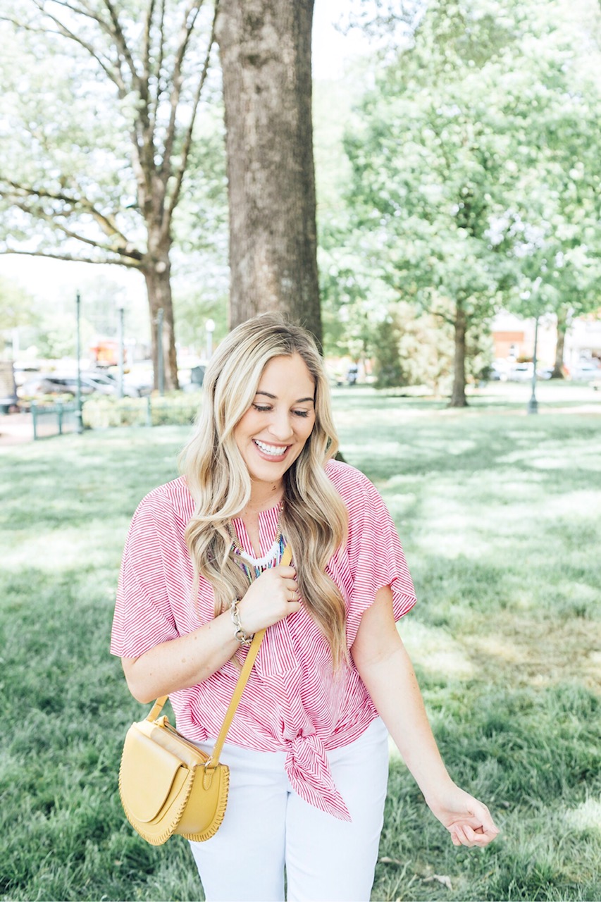 The 5 Most Flattering White Jeans for Summer featured by top US fashion blog, Walking in Memphis in High Heels: image of a woman wearing Chico’s no stain flattering white jeans, Chico’s striped sleeve top, Chico’s colorful bead necklace, and Vince Camuto shorties