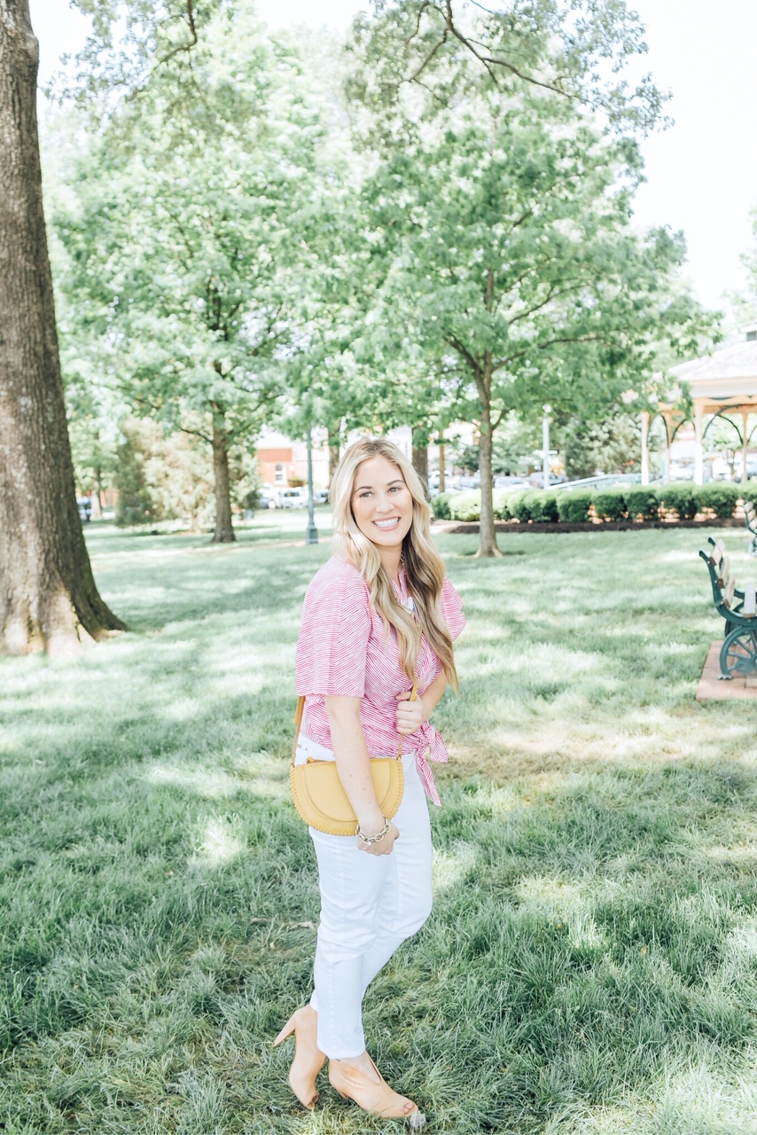 The 5 Most Flattering White Jeans for Summer featured by top US fashion blog, Walking in Memphis in High Heels: image of a woman wearing Chico’s no stain flattering white jeans, Chico’s striped sleeve top, Chico’s colorful bead necklace, and Vince Camuto shorties