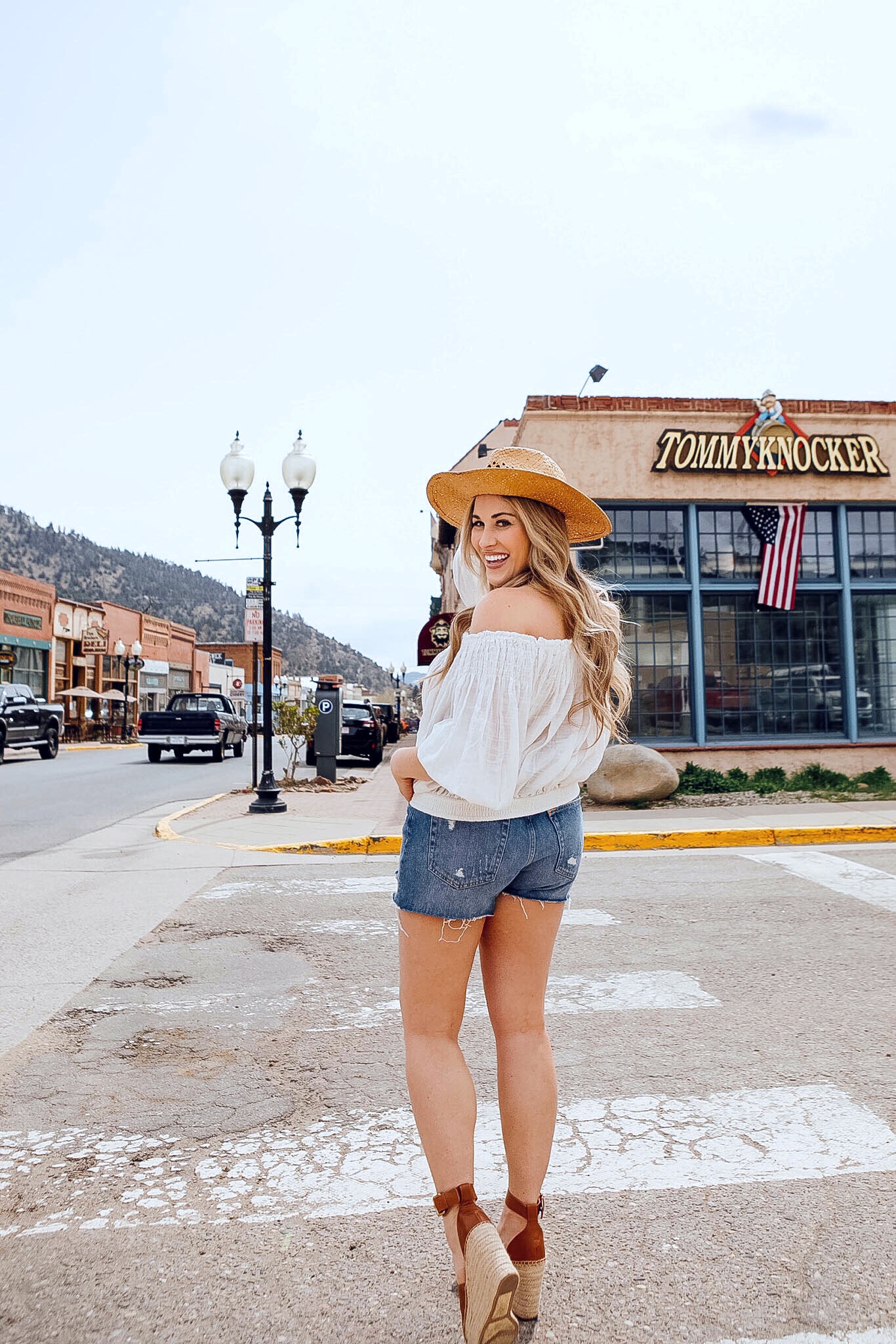 Marc Fisher espadrille wedge sandals styled for summer by top US fashion blog, Walking in Memphis in High Heels: image of a woman wearing a pair of Marc Fisher espadrille wedge sandals, Kendra Scott statement earrings, Free People high waisted denim shorts, and Free People off the shoulder crop topMarc Fisher espadrille wedge sandals styled for summer by top US fashion blog, Walking in Memphis in High Heels: image of a woman wearing a pair of Marc Fisher espadrille wedge sandals, Kendra Scott statement earrings, Free People high waisted denim shorts, and Free People off the shoulder crop top