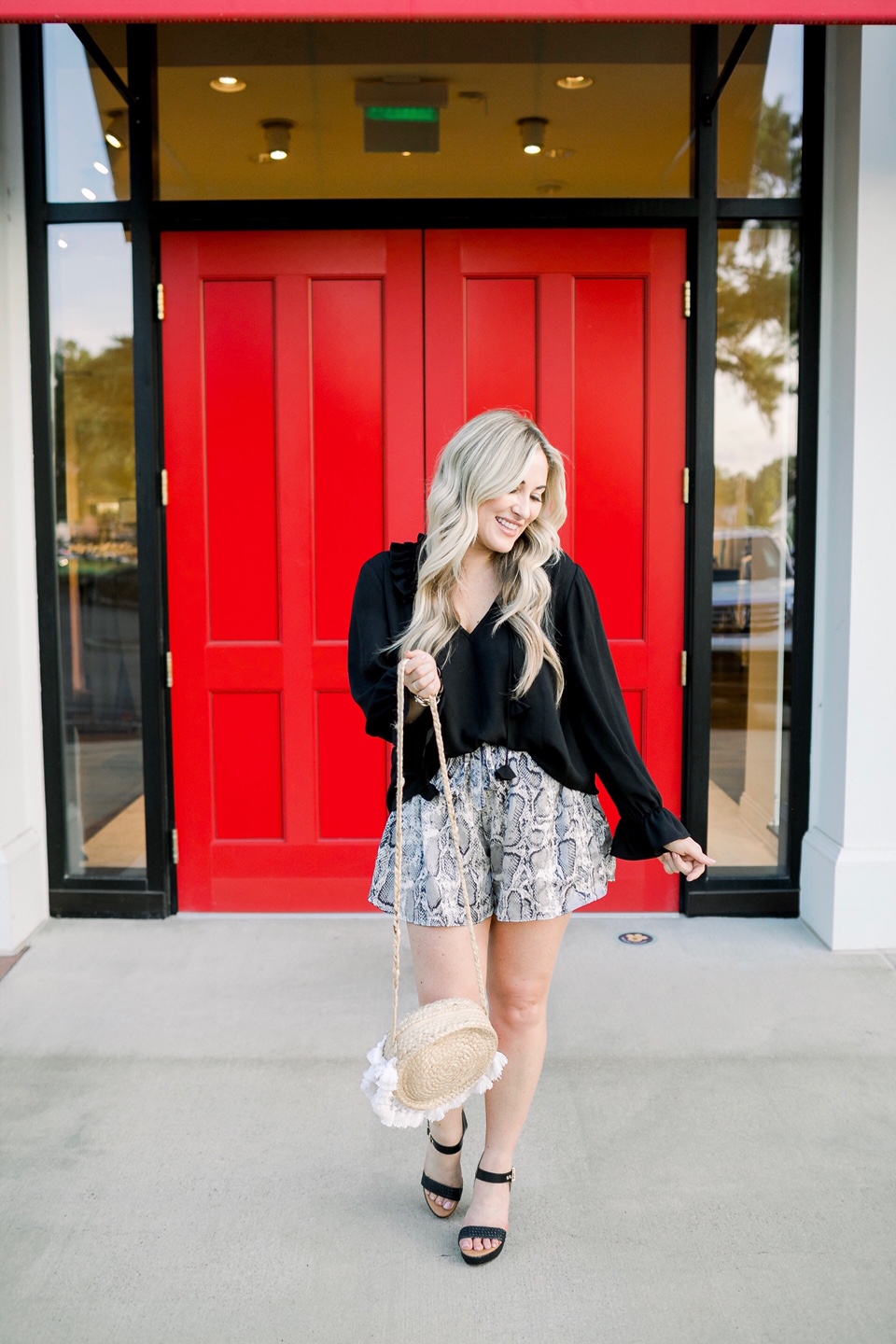 Cute woven sandals featured by top US fashion blog, Walking in Memphis in High Heels: image of a woman wearing Dressing Room Boutique woven sandals, Dressing Room Boutique snakeskin shorts, and a Dillard’s ruffle blouse.