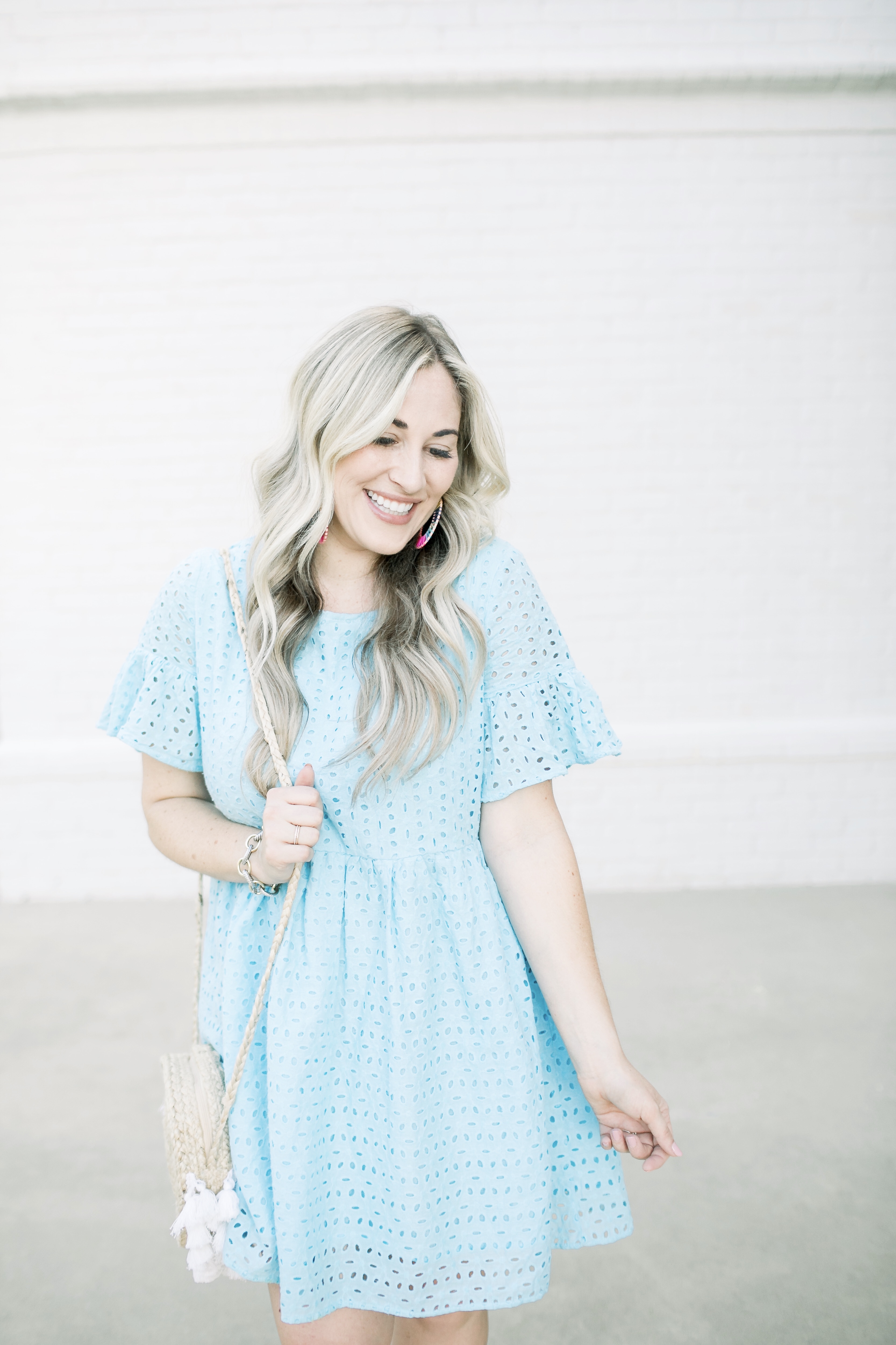 Summer style casual look featured by top US fashion blog, Walking in Memphis in High Heels: image of a woman wearing a SheIn eyelet dress, Marc Fisher espadrille wedge sandals, and BAUBLEBAR raffia statement earrings.