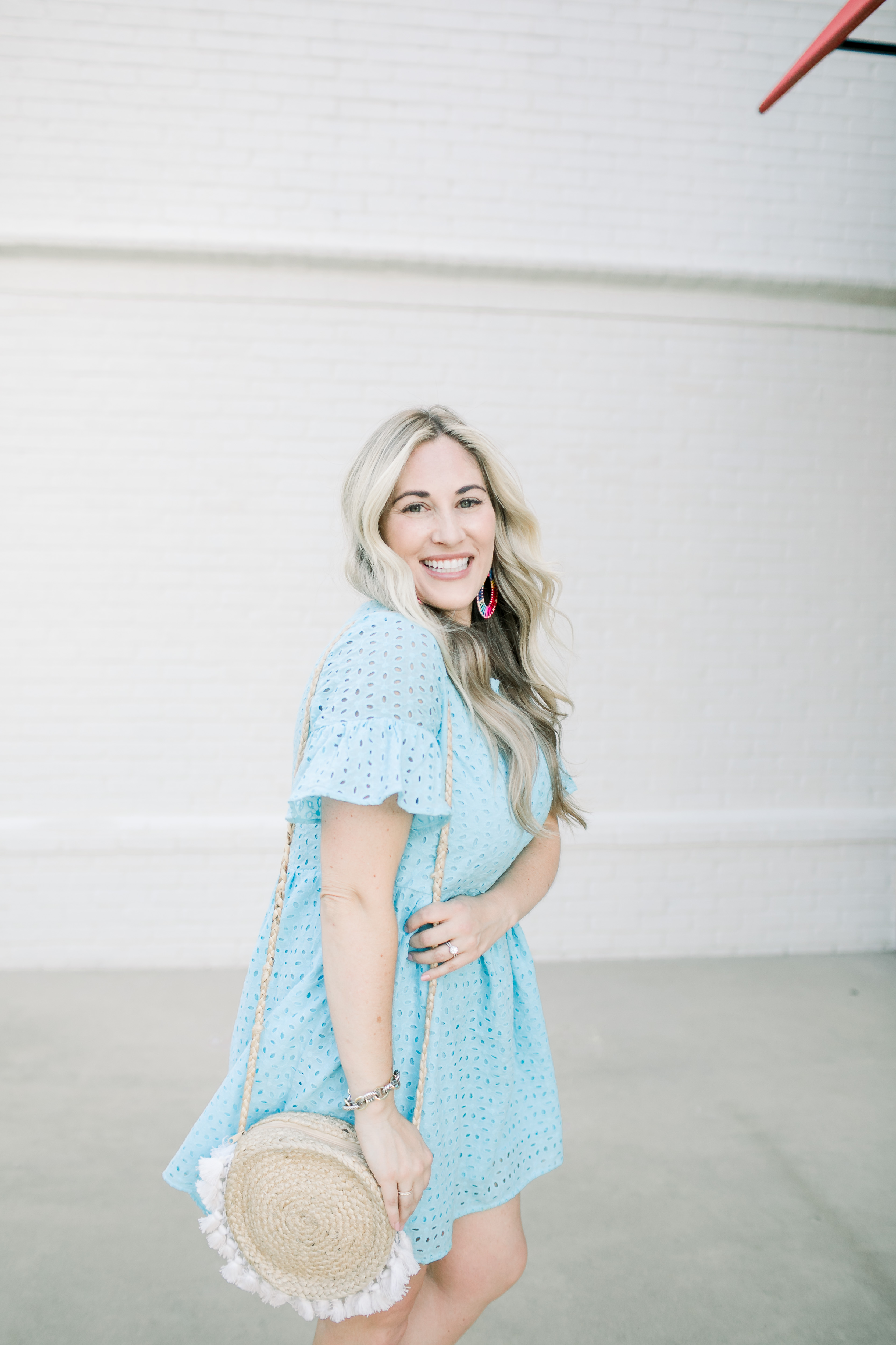 Summer style casual look featured by top US fashion blog, Walking in Memphis in High Heels: image of a woman wearing a SheIn eyelet dress, Marc Fisher espadrille wedge sandals, and BAUBLEBAR raffia statement earrings.