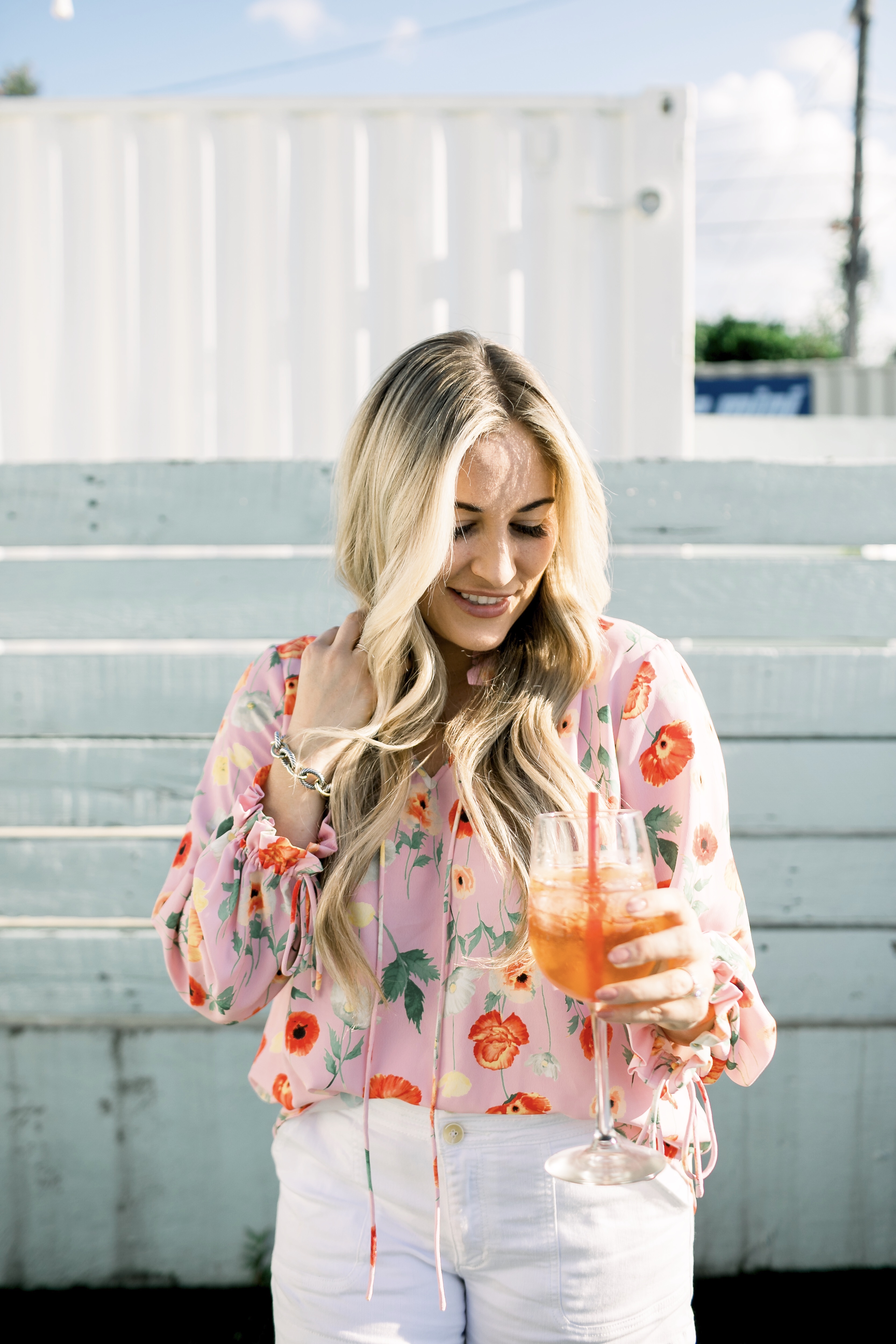 Bright summer colors fashion featured by top US fashion blog, Walking in Memphis in High Heels: image of a woman wearing a Gibson & Latimer floral shirt, Anthropologie high waisted white denim shorts, Tory Burch Miller flip flops and a David Yurman bracelet