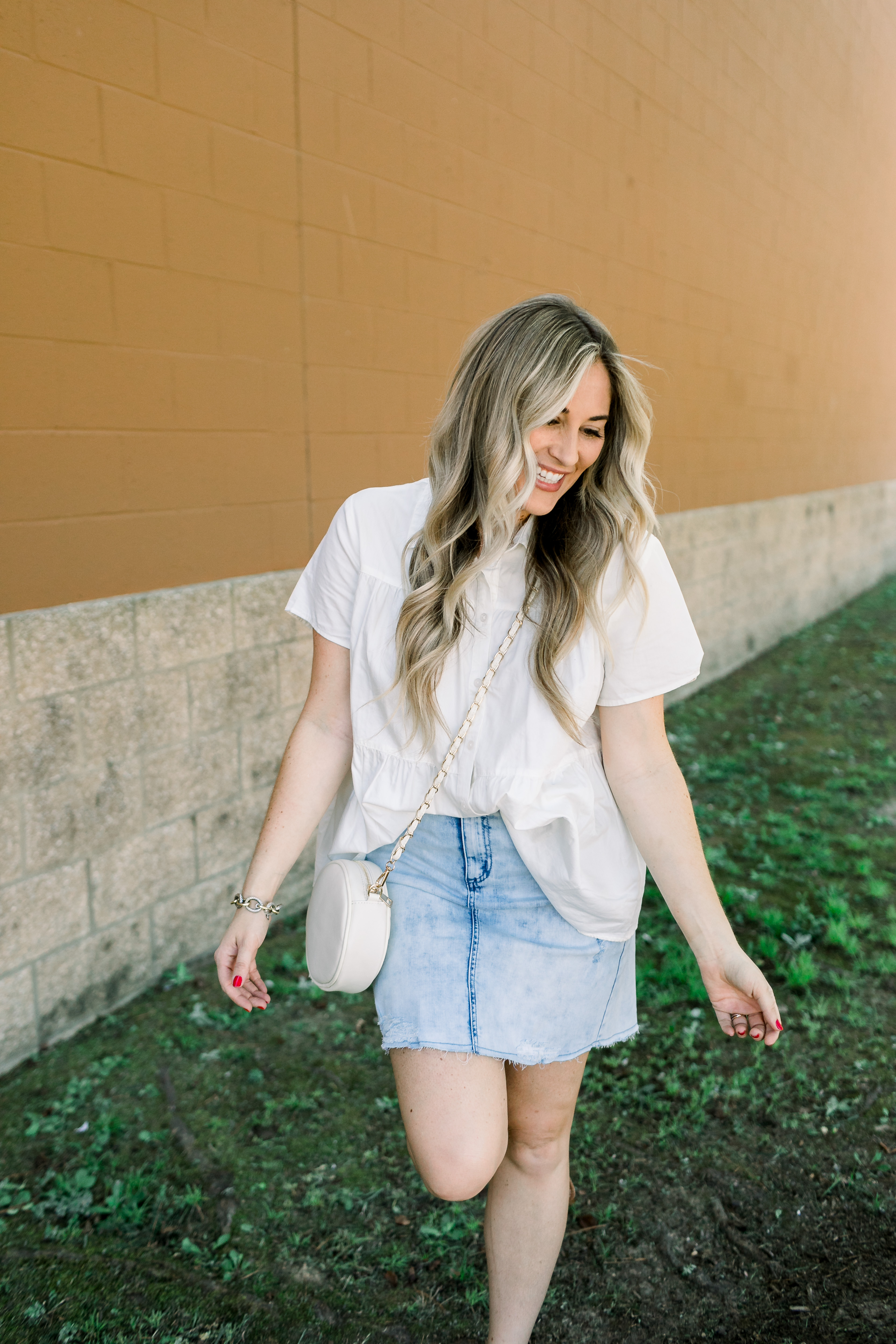 Cute college outfit from Walmart styled by top US fashion blog, Walking in Memphis in High Heels: image of a woman wearing a Time and Tru top, Sofia Jeans by Sofia Vergara denim skirt, and Sam Edelman sandals.