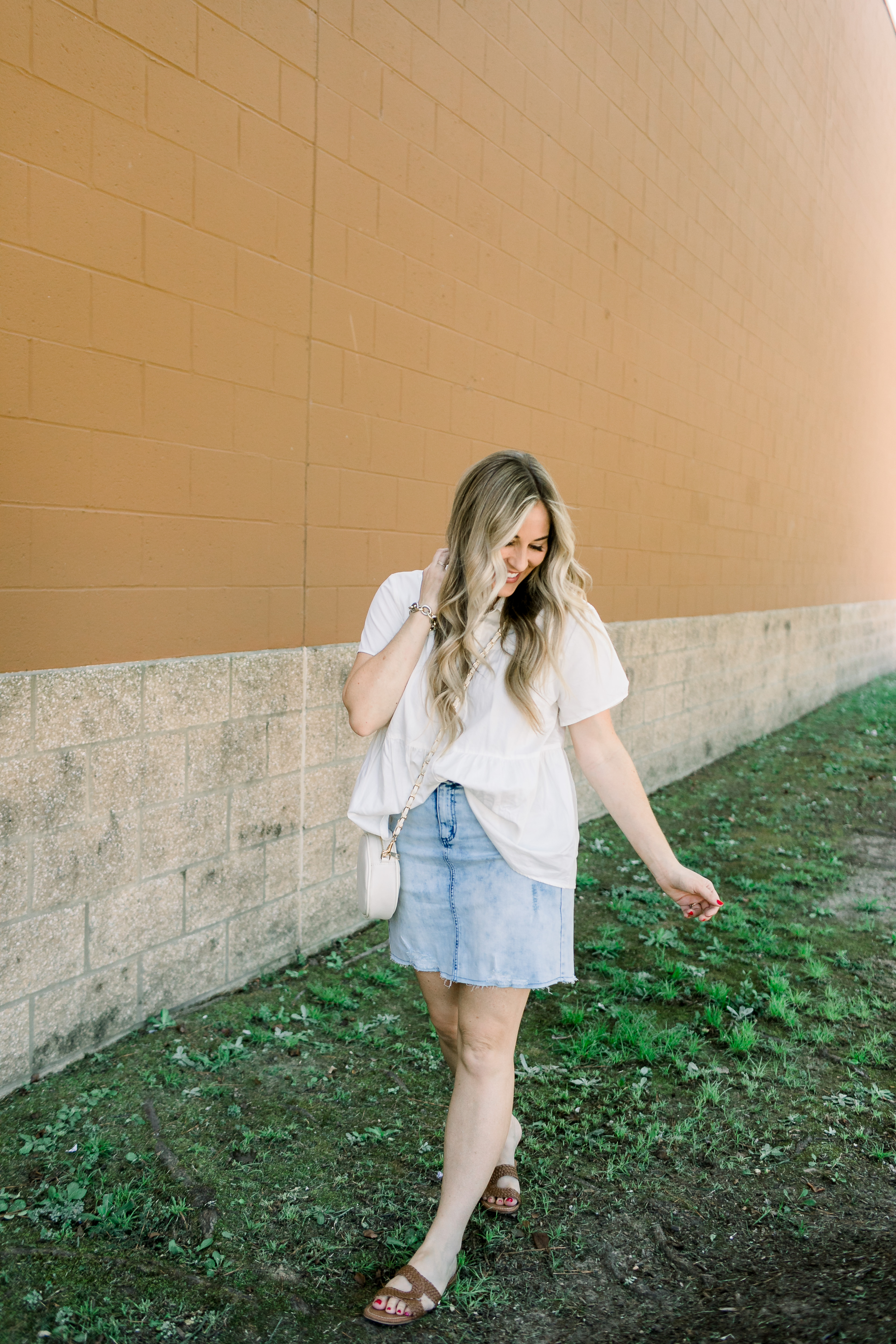 Cute college outfit from Walmart styled by top US fashion blog, Walking in Memphis in High Heels: image of a woman wearing a Time and Tru top, Sofia Jeans by Sofia Vergara denim skirt, and Sam Edelman sandals.