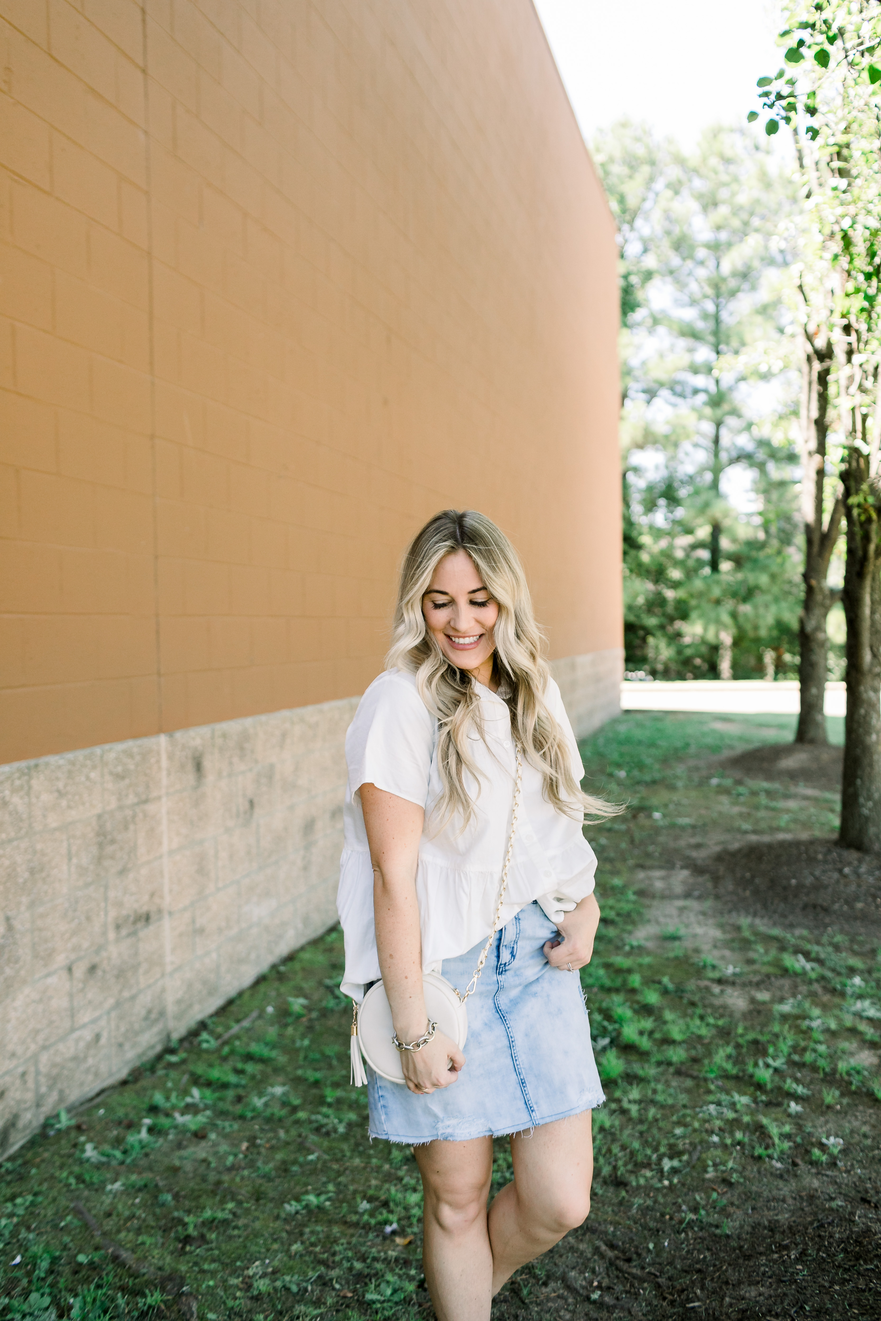 Cute college outfit from Walmart styled by top US fashion blog, Walking in Memphis in High Heels: image of a woman wearing a Time and Tru top, Sofia Jeans by Sofia Vergara denim skirt, and Sam Edelman sandals.