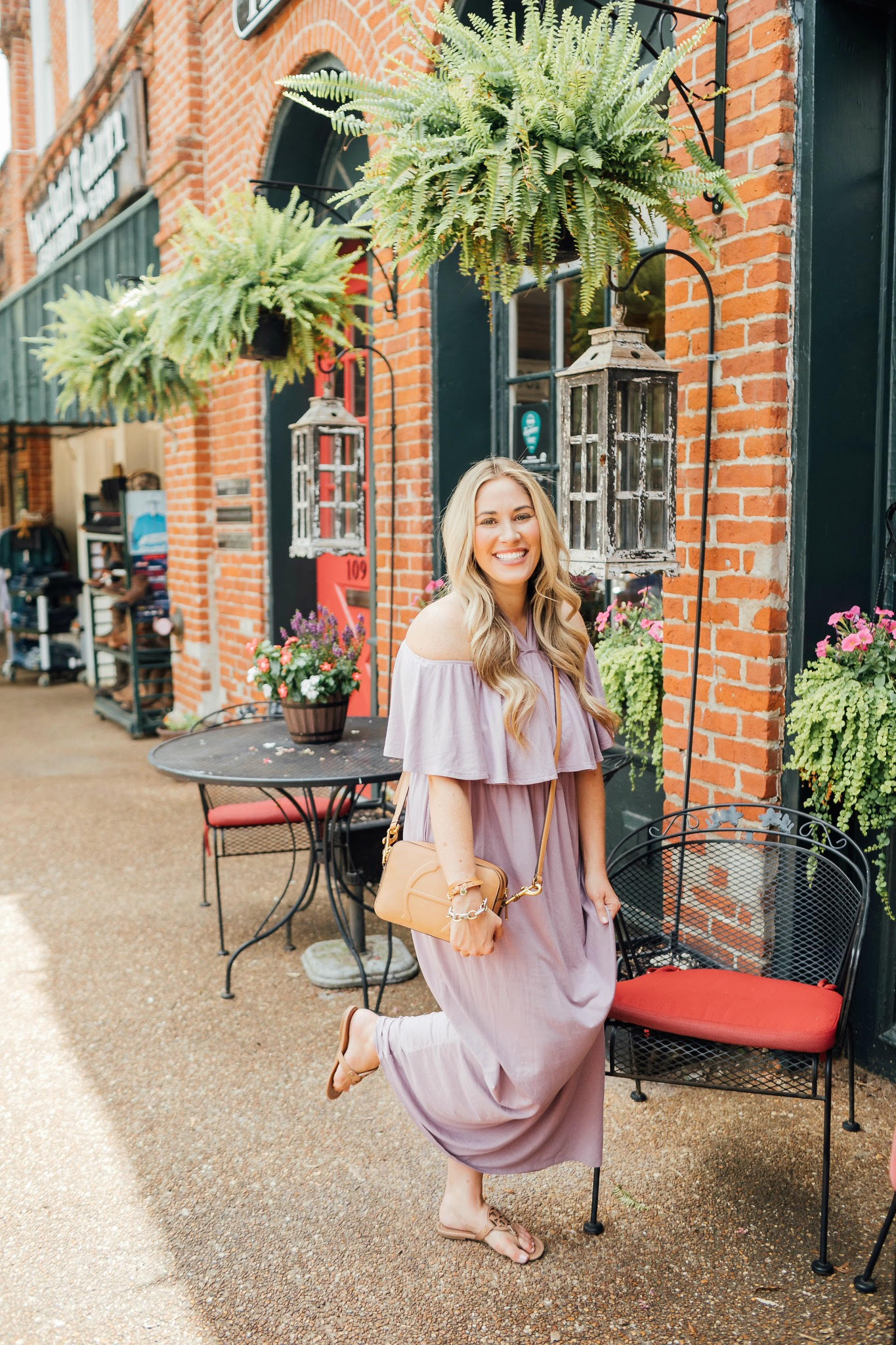 Cute maxi dresses to wear from Summer to Fall featured by top US fashion blog, Walking in Memphis in High Heels: image of a woman wearing a PinkBlush off the shoulder maxi dress, and Tory Burch Miller flip flops.