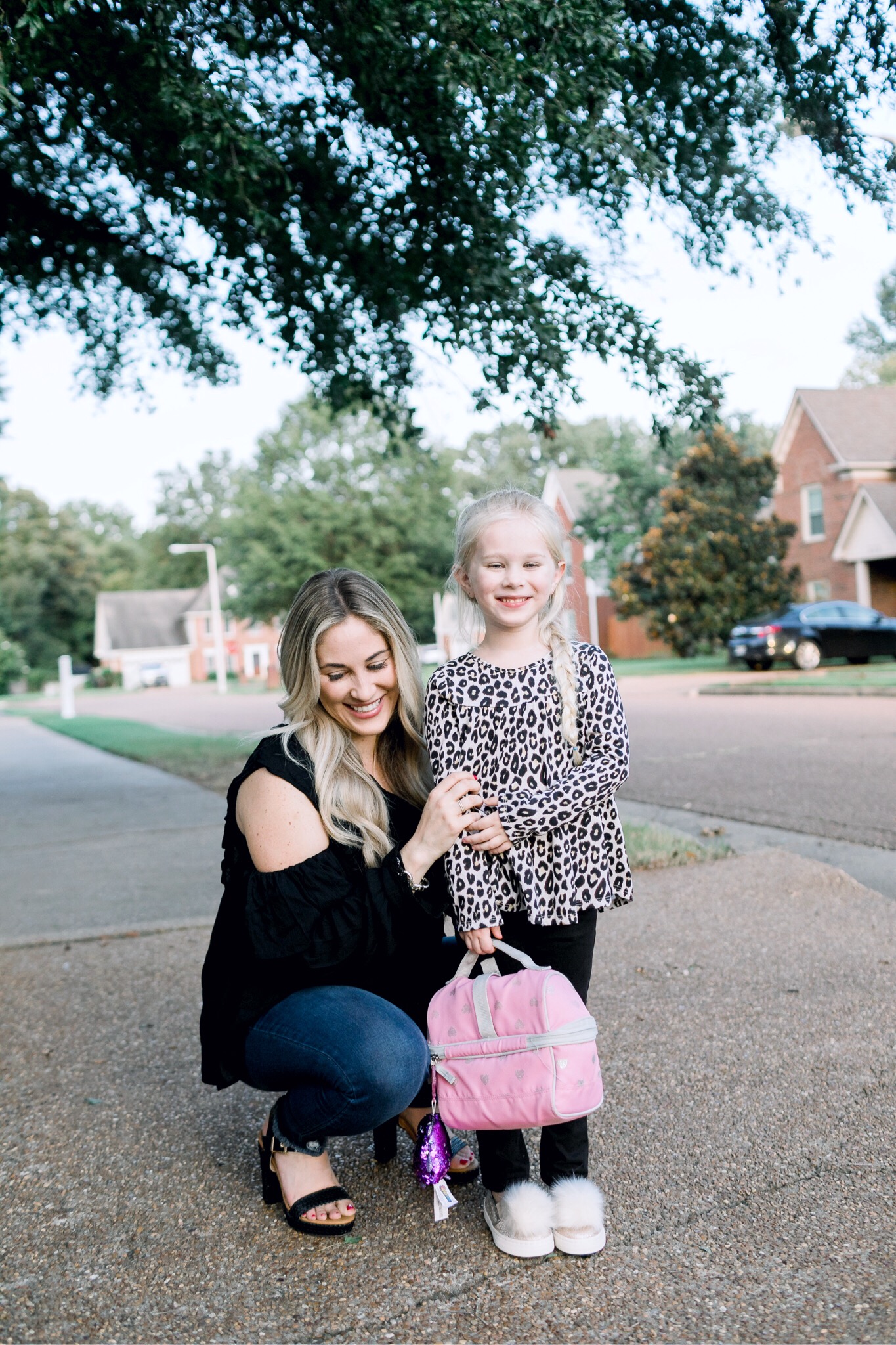 Walmart back to school style featured by top US fashion blog, Walking in Memphis in High Heels: image of a woman wearing Sofia Jeans by Sofia Vergara high waisted jeans, and a Love Sadie black blouse, and a little girl wearing a Garanimals 2 piece set, and The Children’s Place pom slip ons.
