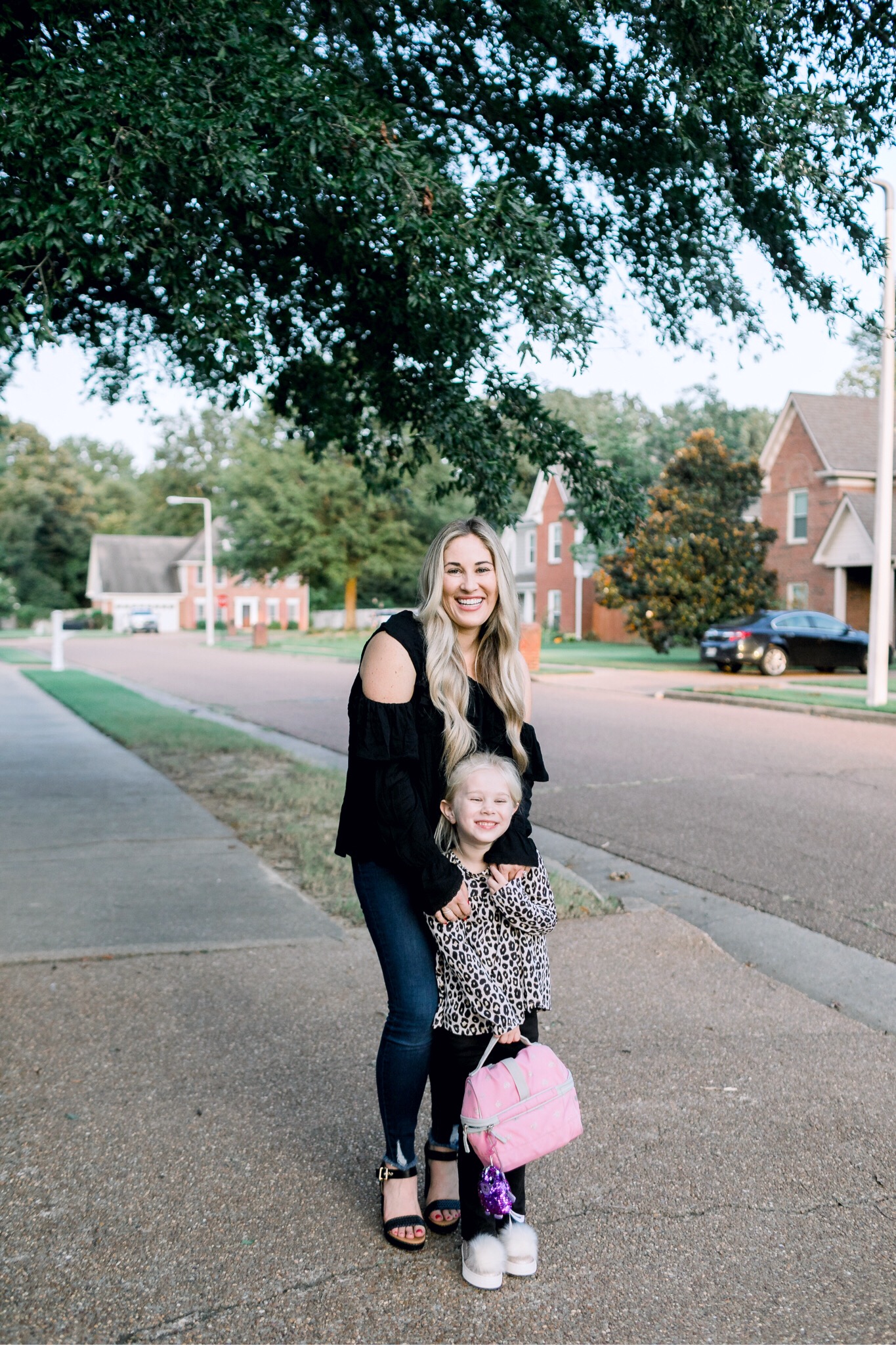 Walmart back to school style featured by top US fashion blog, Walking in Memphis in High Heels: image of a woman wearing Sofia Jeans by Sofia Vergara high waisted jeans, and a Love Sadie black blouse, and a little girl wearing a Garanimals 2 piece set, and The Children’s Place pom slip ons.