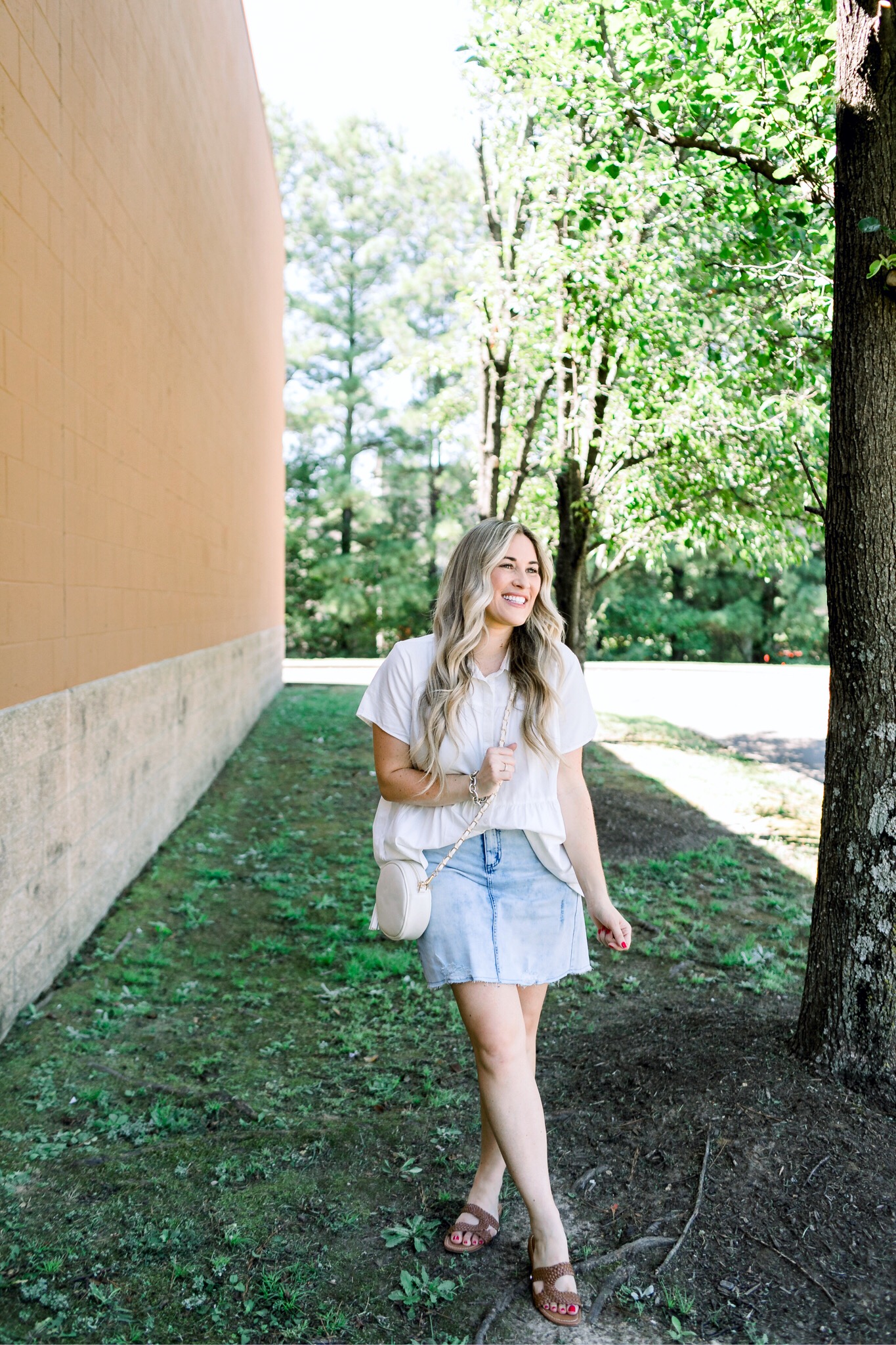 Cute college outfit from Walmart styled by top US fashion blog, Walking in Memphis in High Heels: image of a woman wearing a Time and Tru top, Sofia Jeans by Sofia Vergara denim skirt, and Sam Edelman sandals.