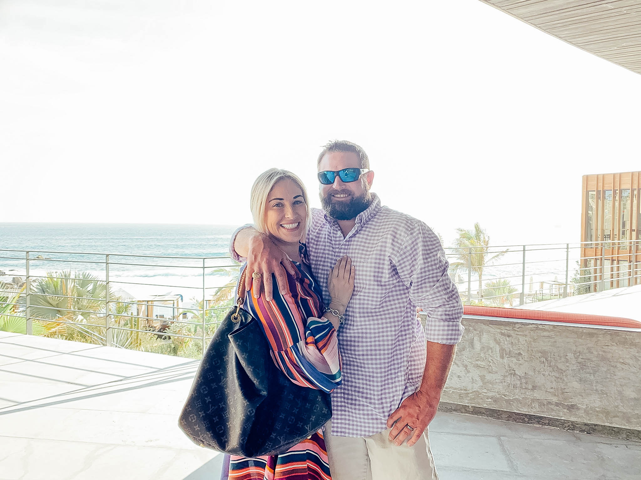 Top 10 Fall Honeymoon Destinations featured by top US travel blog, Walking in Memphis in High Heels: image of a couple in Cabo San Lucas, Mexico