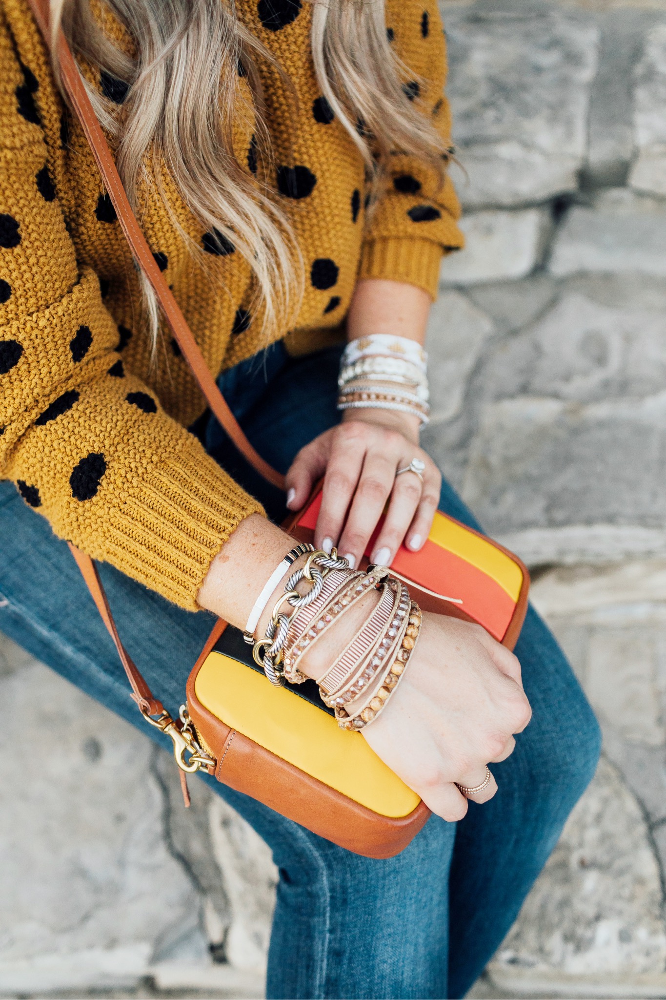 Fall trend colors featured by top US fashion blog, Walking in Memphis in High Heels: image of a woman wearing Good American skinny jeans, Vince Camuto booties, Clare V. Striped crossbody bags, and  Victoria Emerson stackable bracelets.