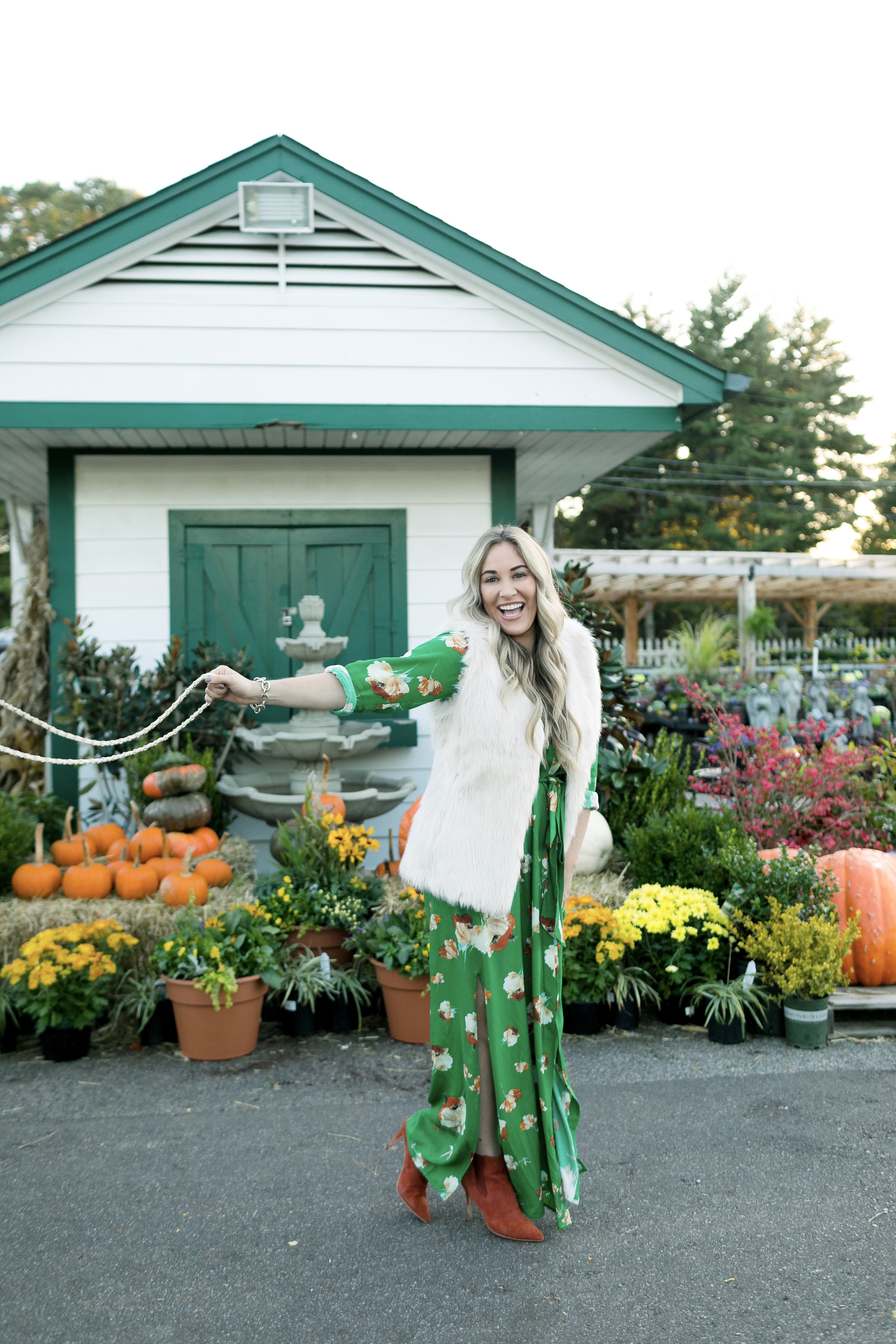 What to Wear for Thanksgiving, outfit featured by top US fashion blog, Walking in Memphis in High Heels: image of a woman wearing a Socialite utility maxi dress, La Fiorentina faux fur vest, ALDO ankle boots and a J.Crew faux leather round bag.