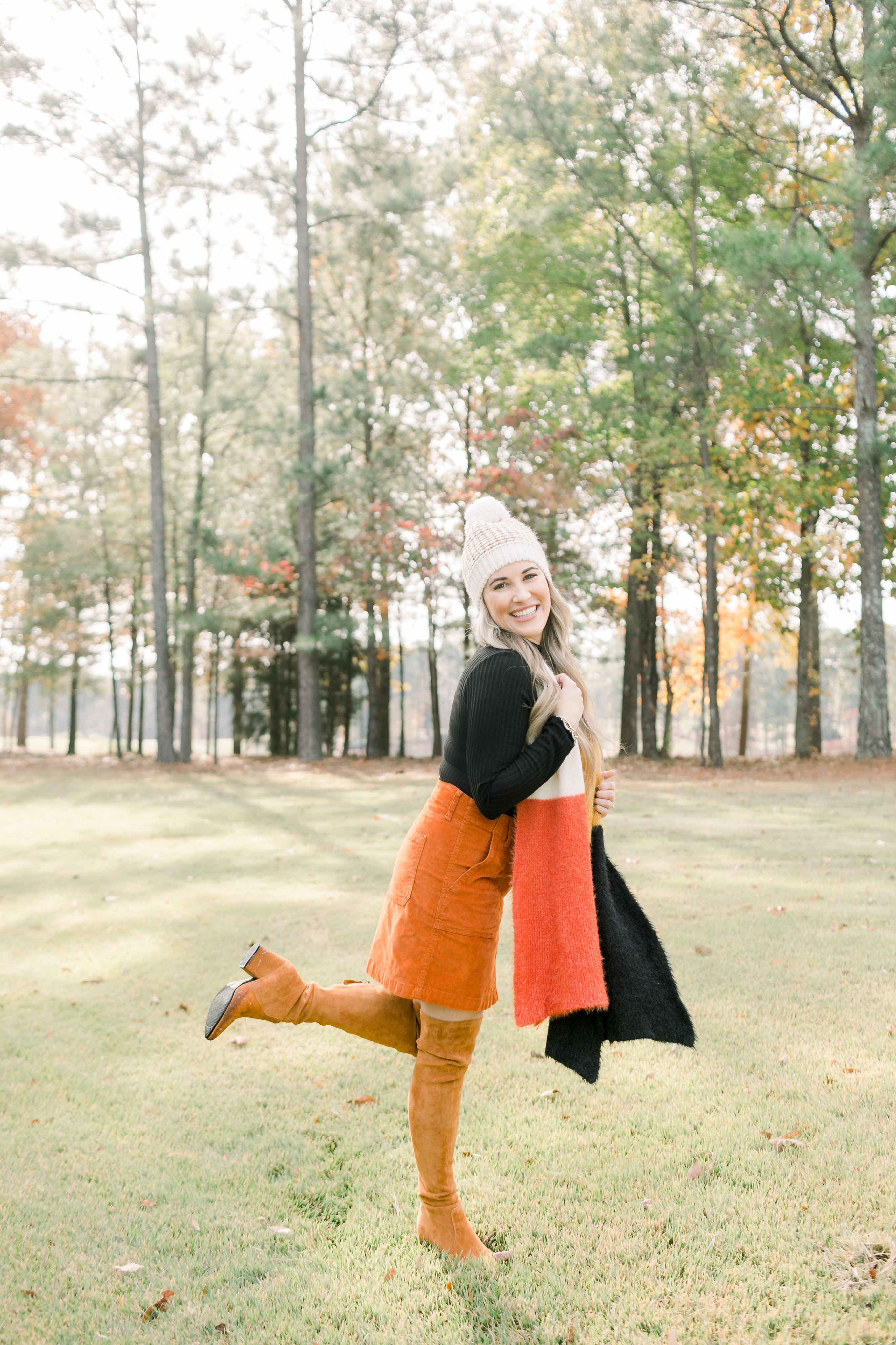 Fall Footwear featured by top US fashion blog, Walking in Memphis in High Heels: image of a woman wearing Goodnight Macaron knee high suede leather boots.