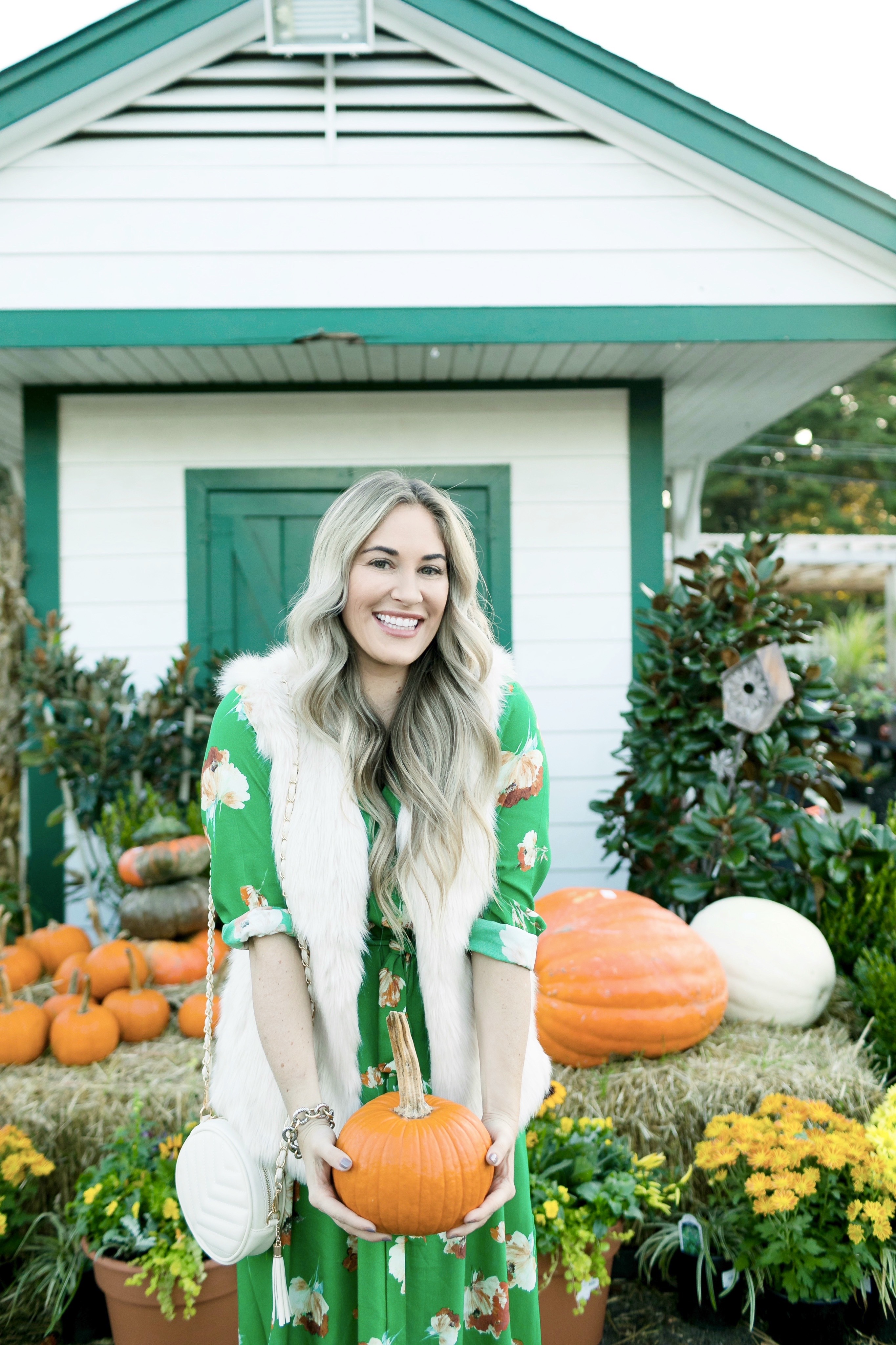 What to Wear for Thanksgiving, outfit featured by top US fashion blog, Walking in Memphis in High Heels: image of a woman wearing a Socialite utility maxi dress, La Fiorentina faux fur vest, ALDO ankle boots and a J.Crew faux leather round bag.