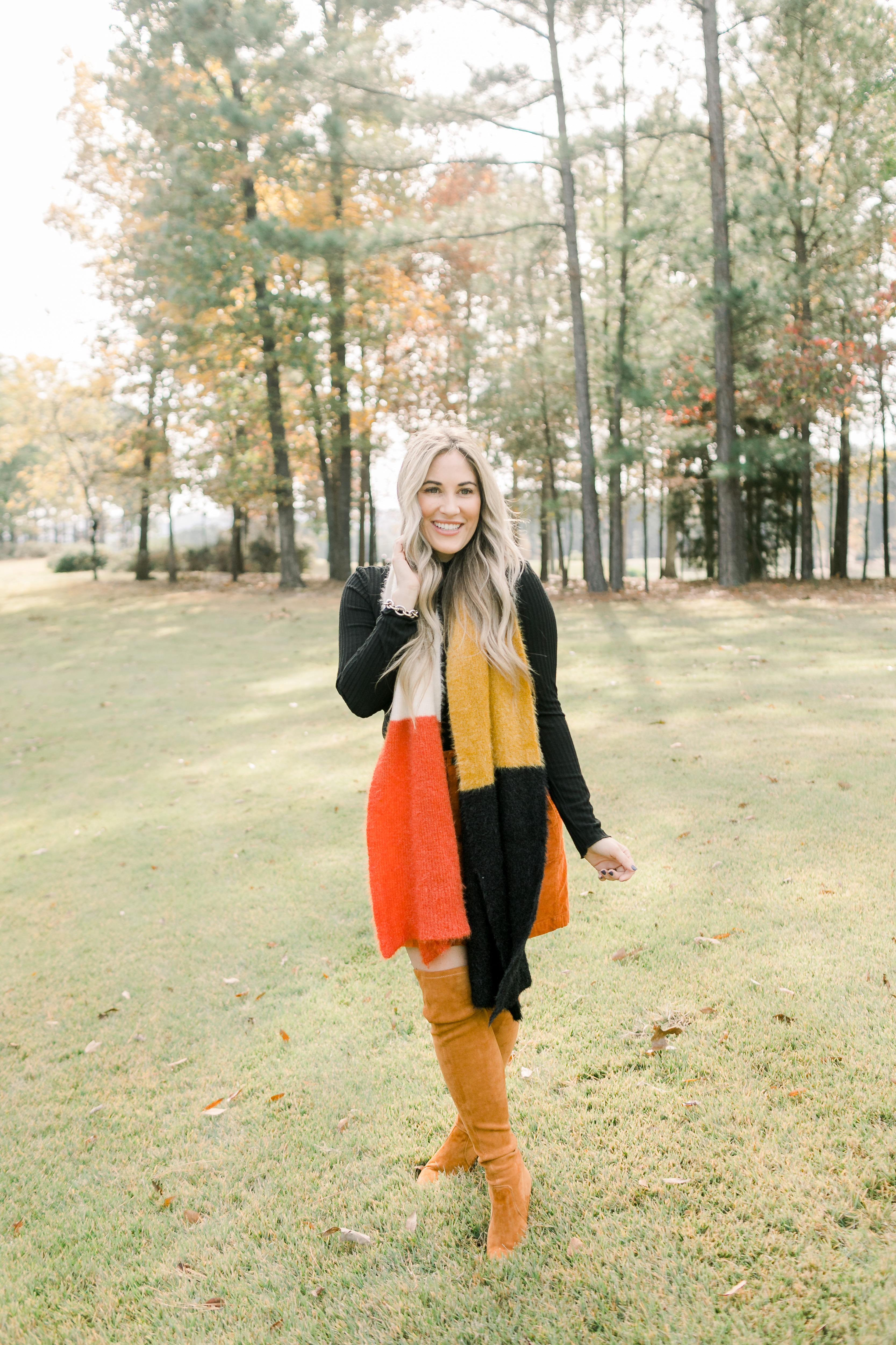 Fall Footwear featured by top US fashion blog, Walking in Memphis in High Heels: image of a woman wearing Goodnight Macaron knee high suede leather boots.