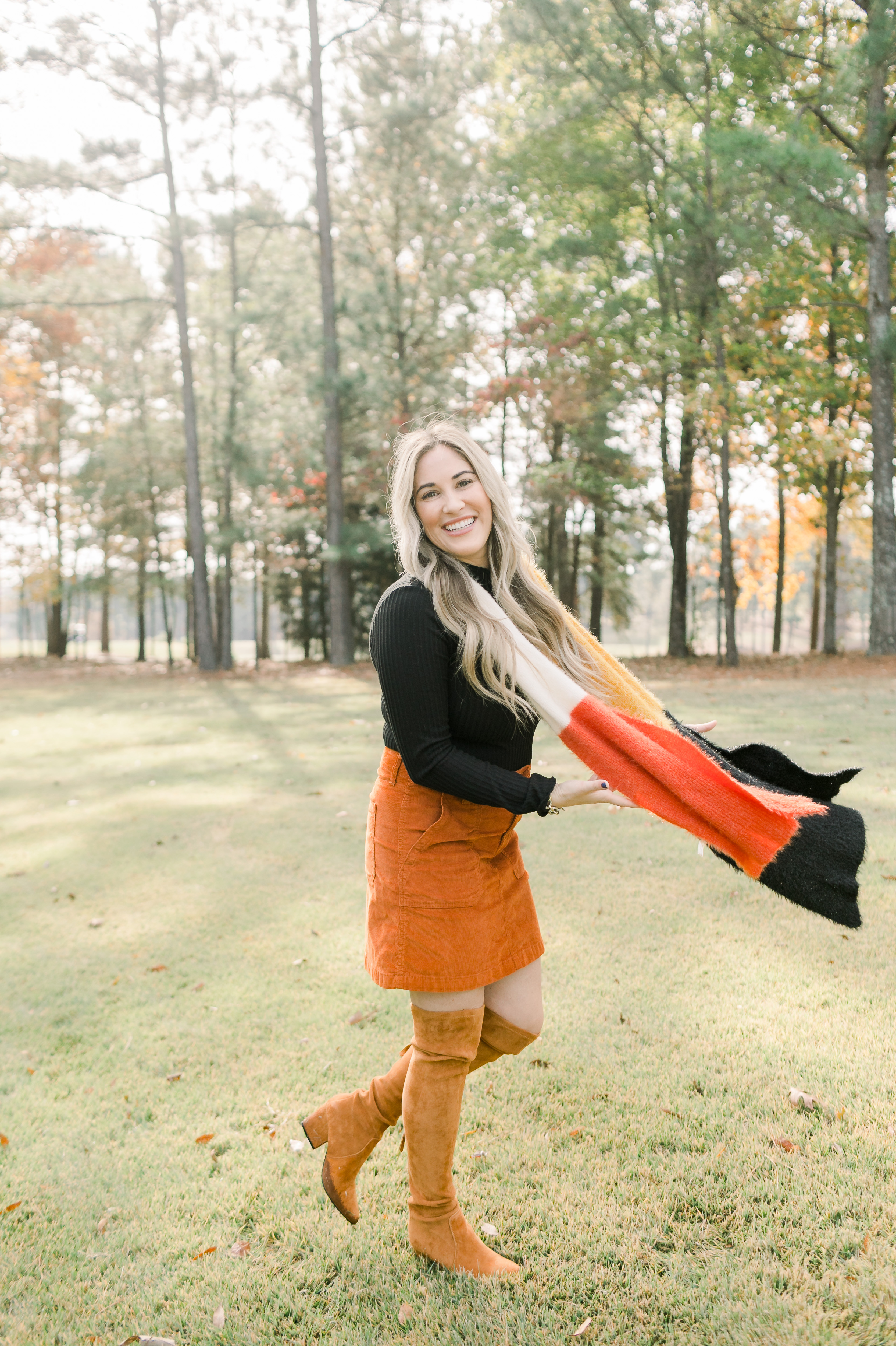 Fall Footwear featured by top US fashion blog, Walking in Memphis in High Heels: image of a woman wearing Goodnight Macaron knee high suede leather boots.