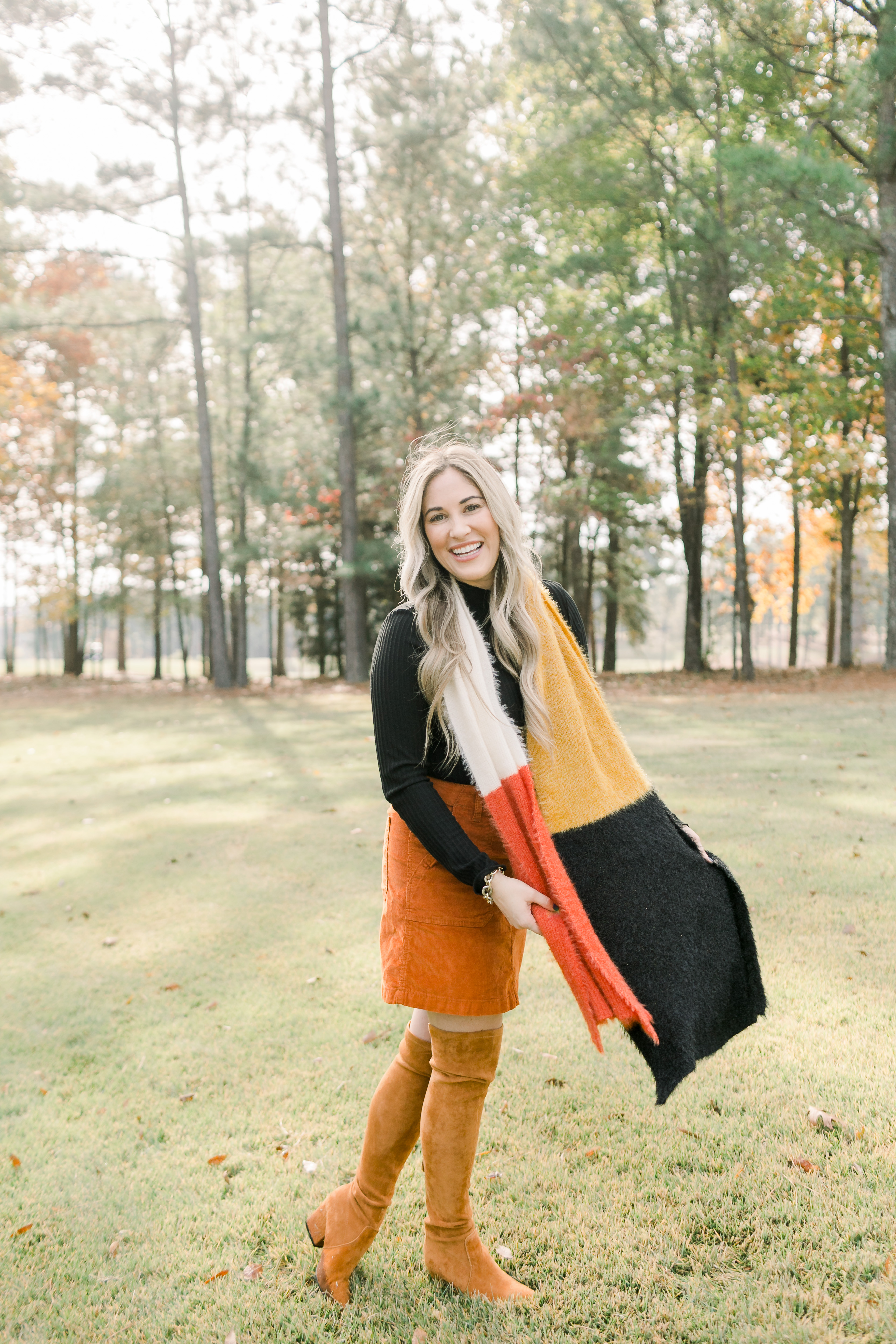 Fall Footwear featured by top US fashion blog, Walking in Memphis in High Heels: image of a woman wearing Goodnight Macaron knee high suede leather boots.