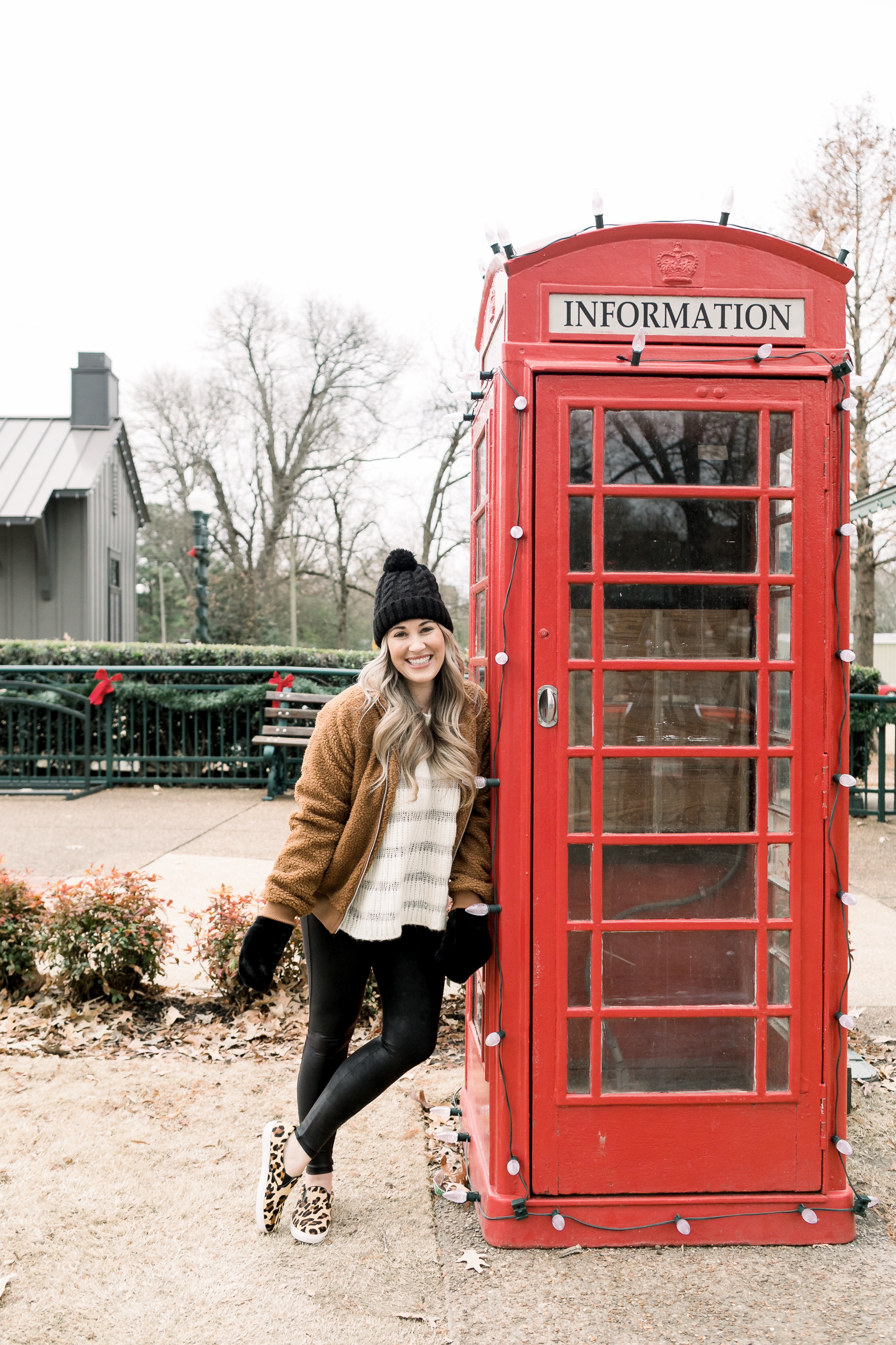 Cozy winter look styled by top US fashion blog, Walking in Memphis in High Heels: image of a woman wearing a Free People cropped sweater, New York Accessory Group pom beanie, Love + Joy teddy bear jacket, Kohl’s faux fur mittens, and Steve Madden leopard sneakers.